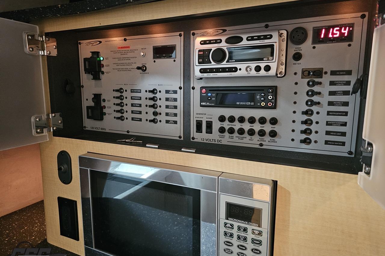 Control panel and microwave in a 2008 Baja 335 Performance boat interior.
