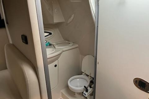 2012 Bayliner 285 Cruiser bathroom interior with toilet and sink.