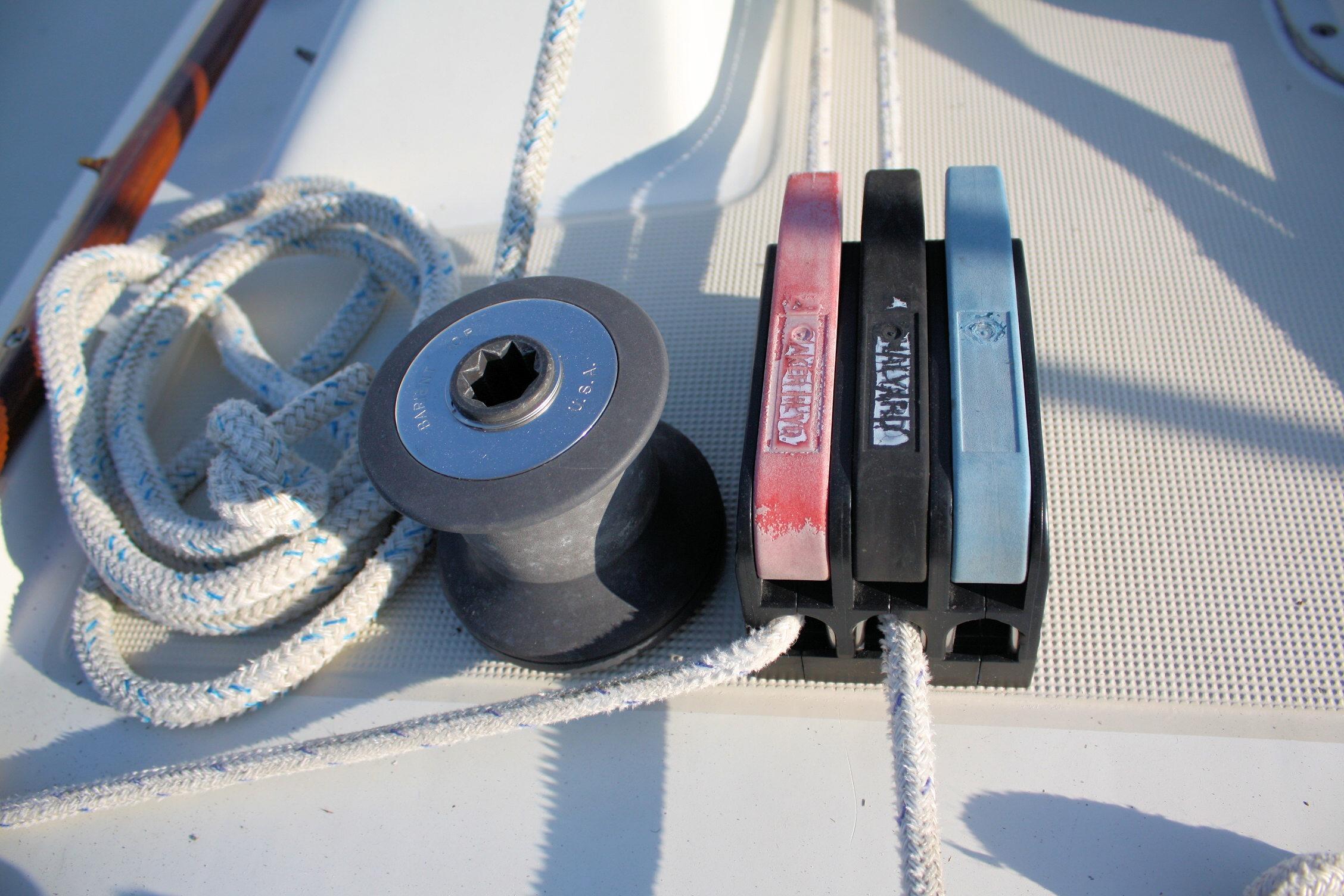 Deck equipment on a 1987 Ericson 38-200 sailboat, featuring winch and rope clutches.