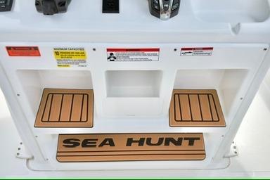 2026 Sea Hunt Ultra 255 SE boat console with storage compartments and Sea Hunt branding.