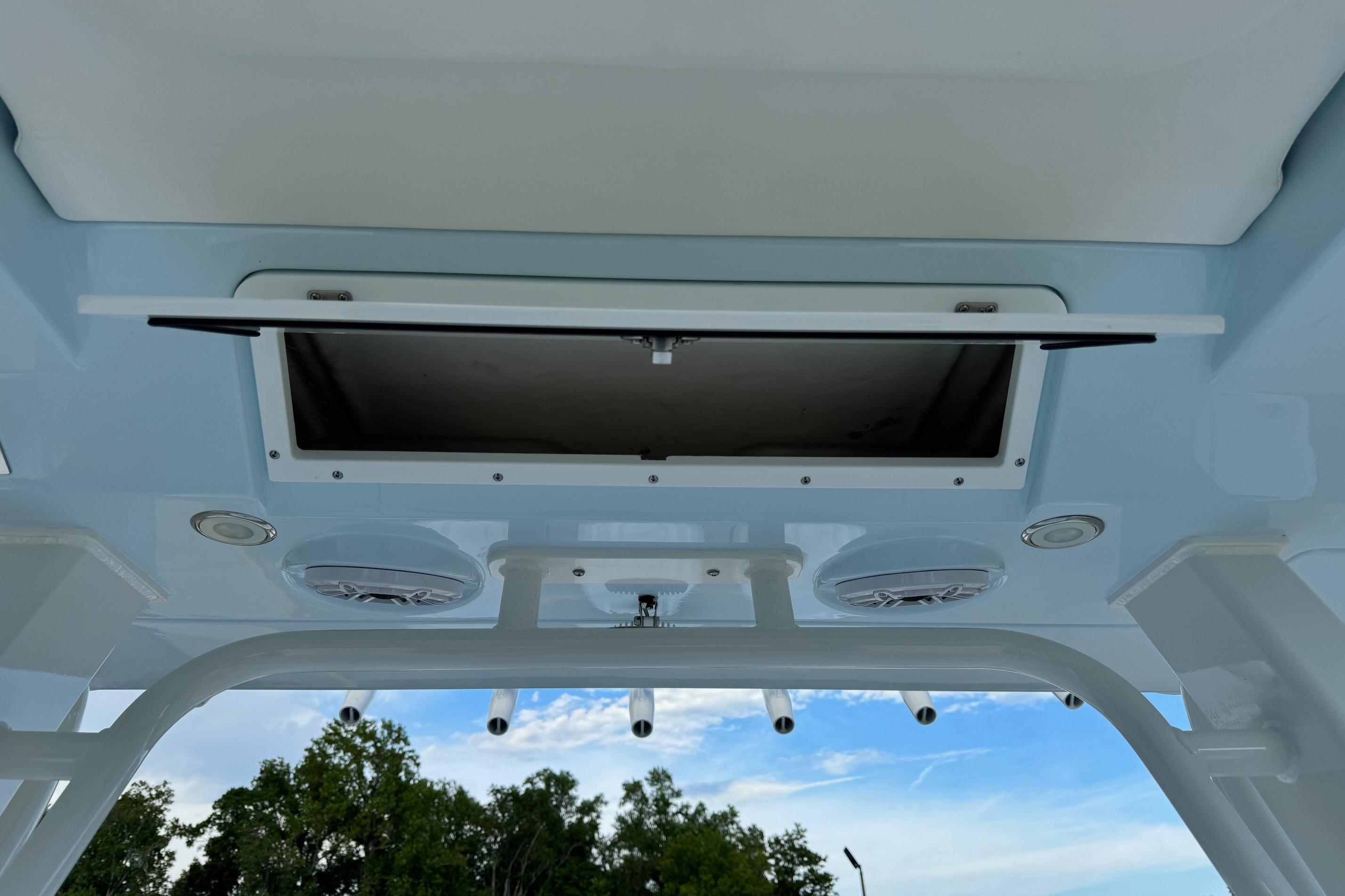 2025 Robalo R360 Center Console boat ceiling with open hatch and speakers.
