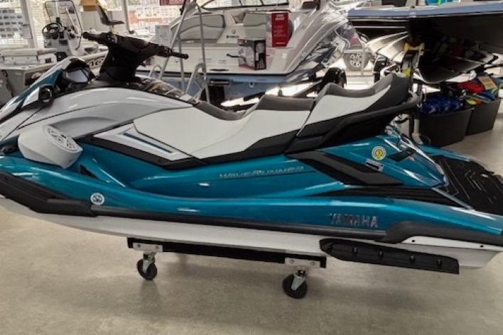 2026 Yamaha WaveRunner FX Cruiser HO in showroom, teal and white design.
