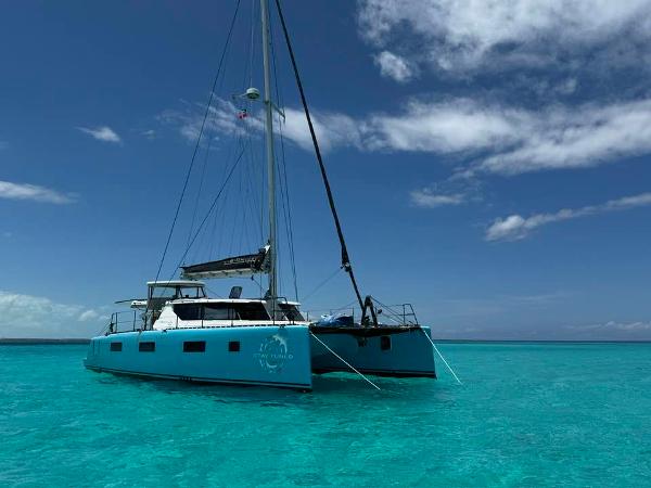 Vision 444 catamaran sailing in clear turquoise waters under a blue sky, 2025 model.