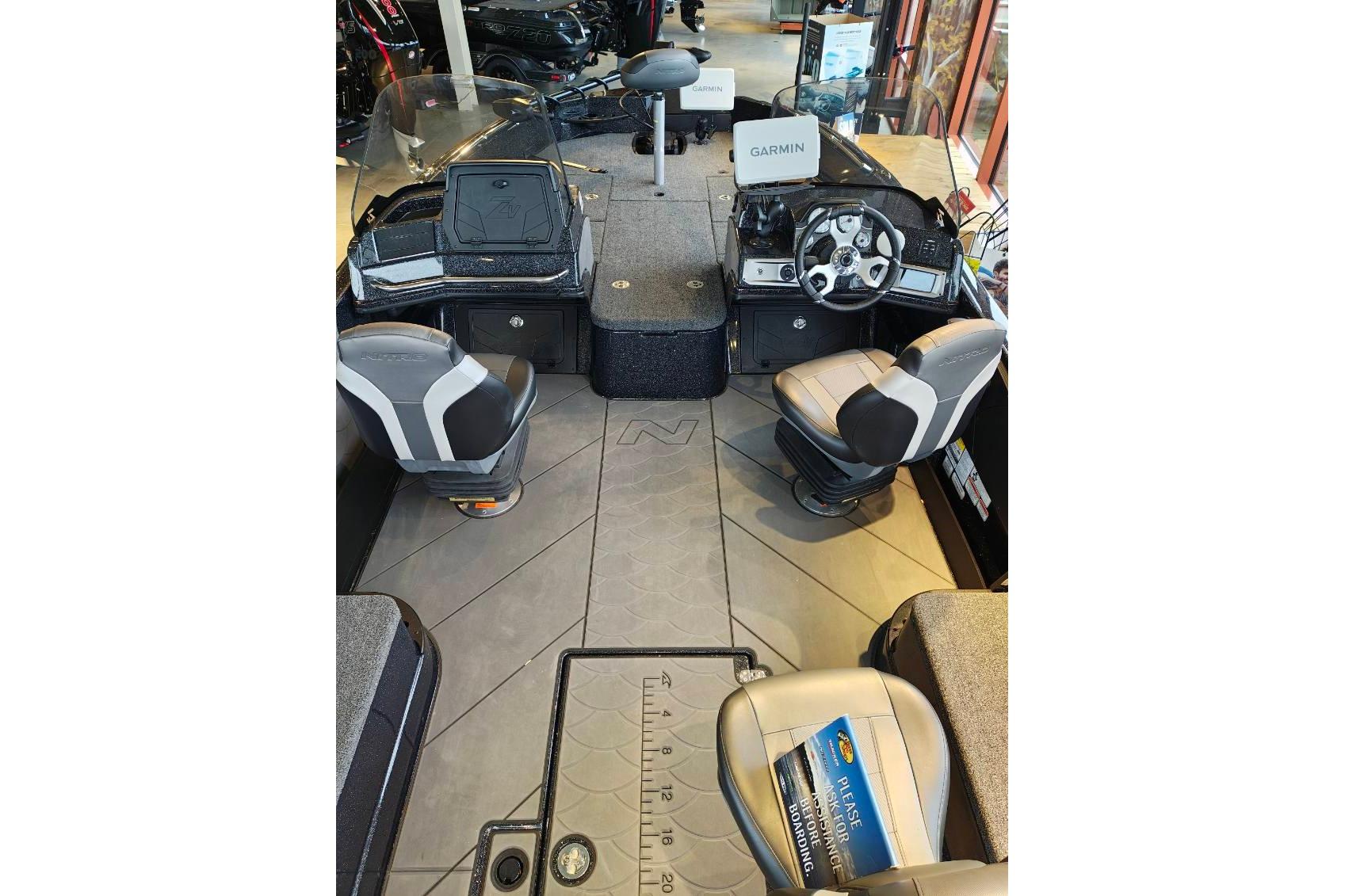 Interior view of 2026 Nitro ZV21 boat with Garmin navigation system and seating.