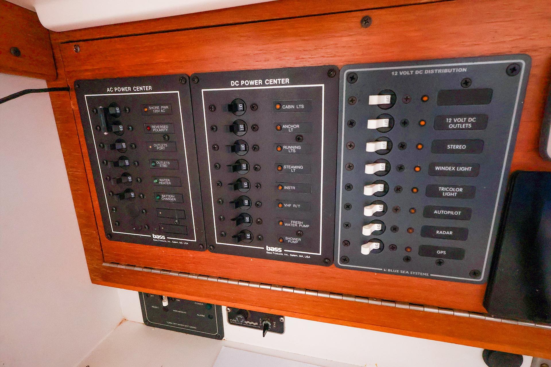 Electrical panel on a 2001 J Boats J/32, featuring AC and DC power controls.