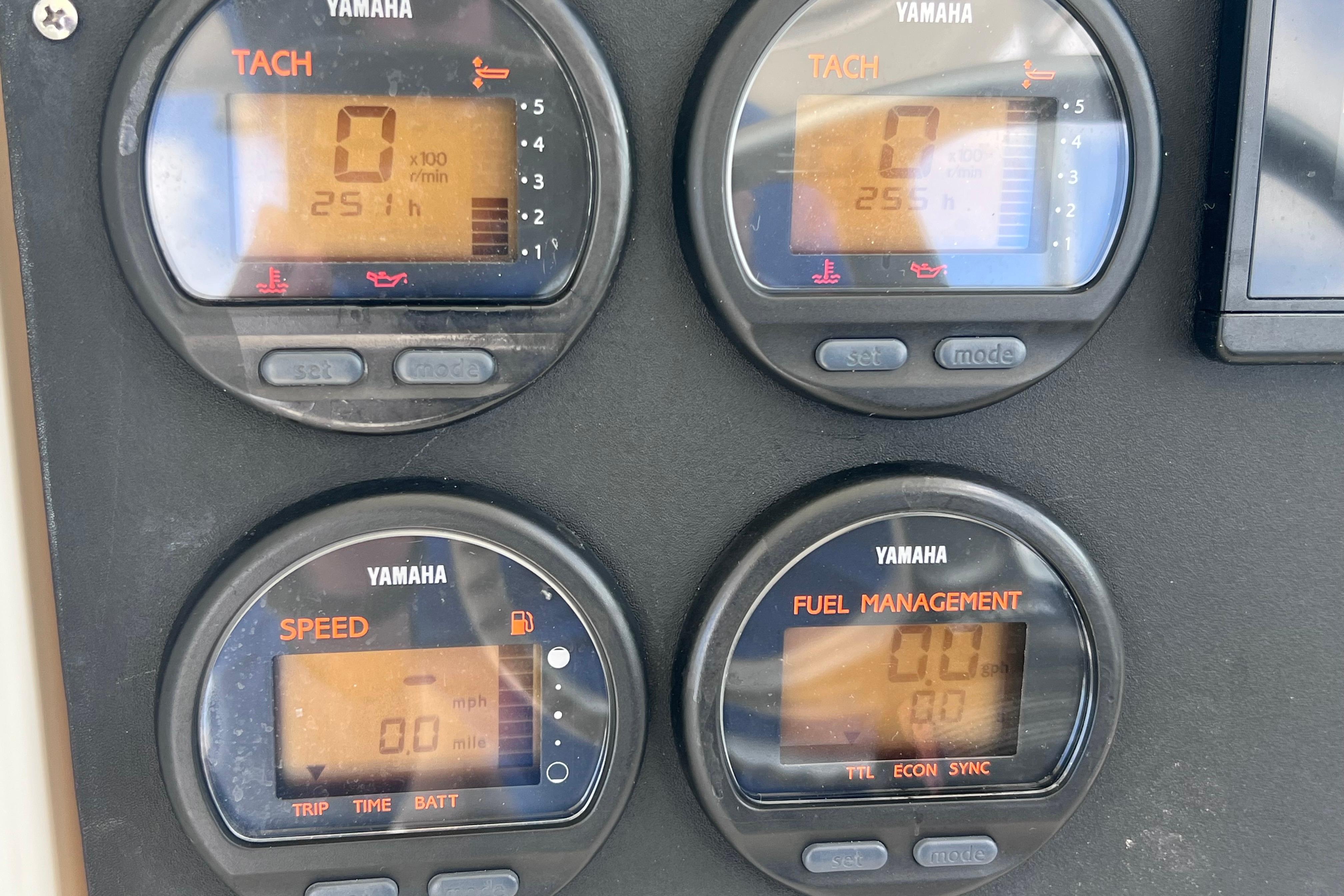 Yamaha gauges on a 2004 Pursuit 2870 Walkaround boat dashboard display.