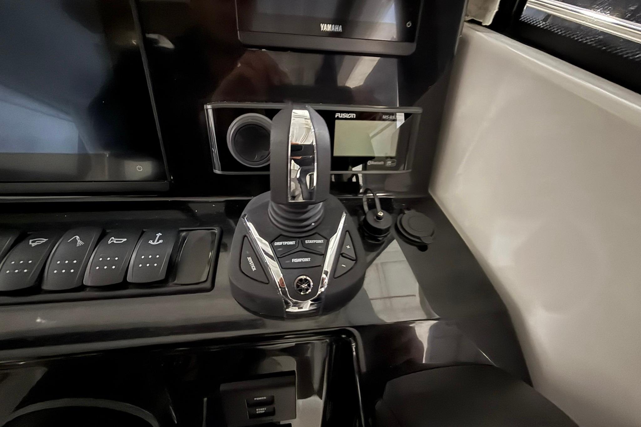 2024 Jeanneau NC Sport 795 Series 2 dashboard with control panel and joystick.