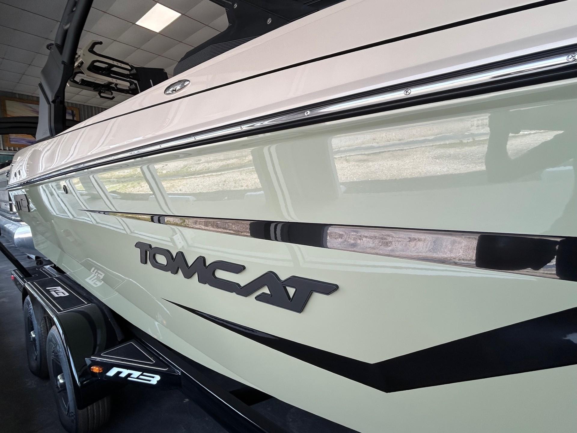 2024 MB F22 Tomcat boat side view with logo and trailer.