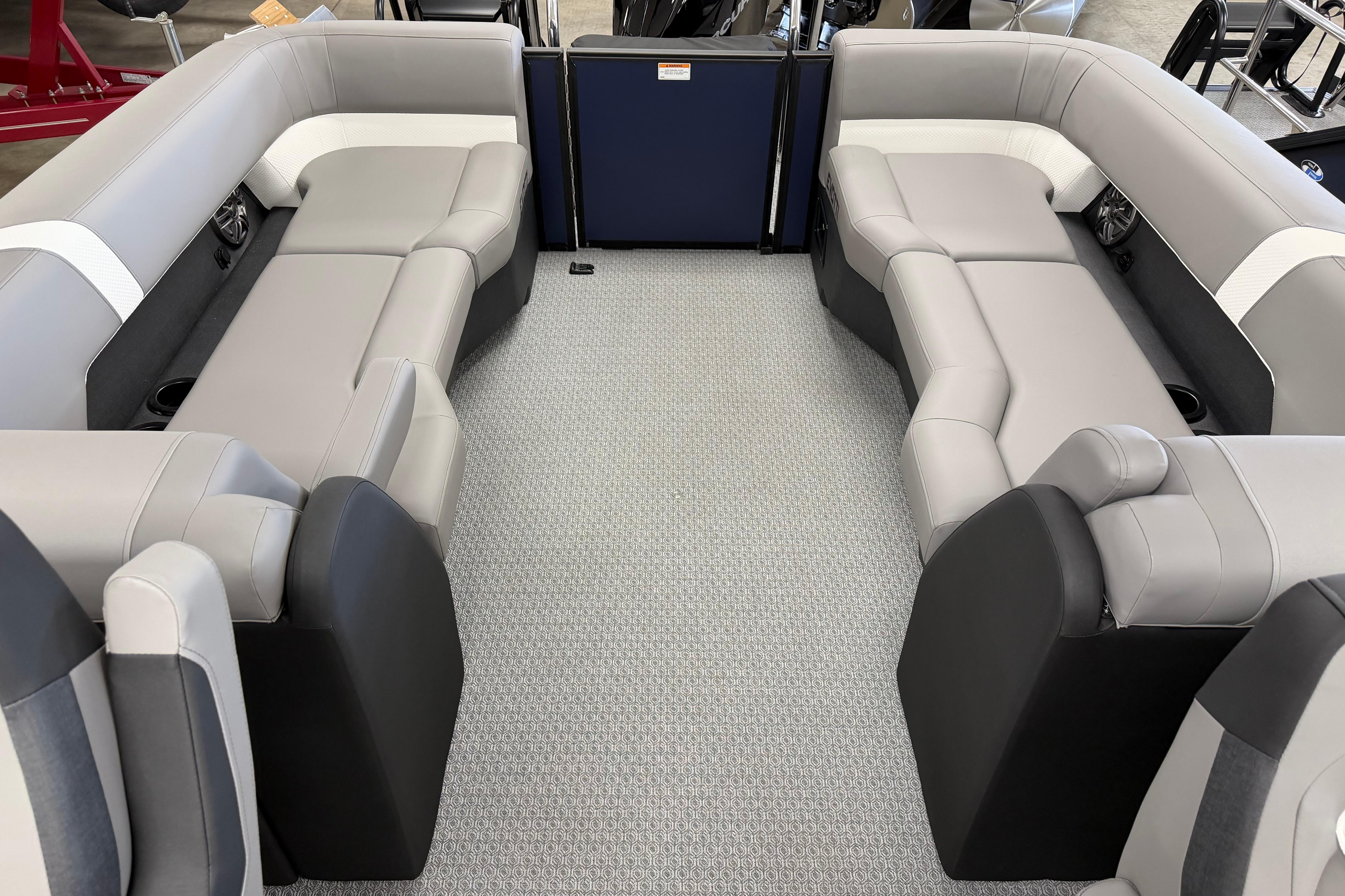 Luxurious seating area in 2026 Evotti 523QL boat, featuring modern gray upholstery.