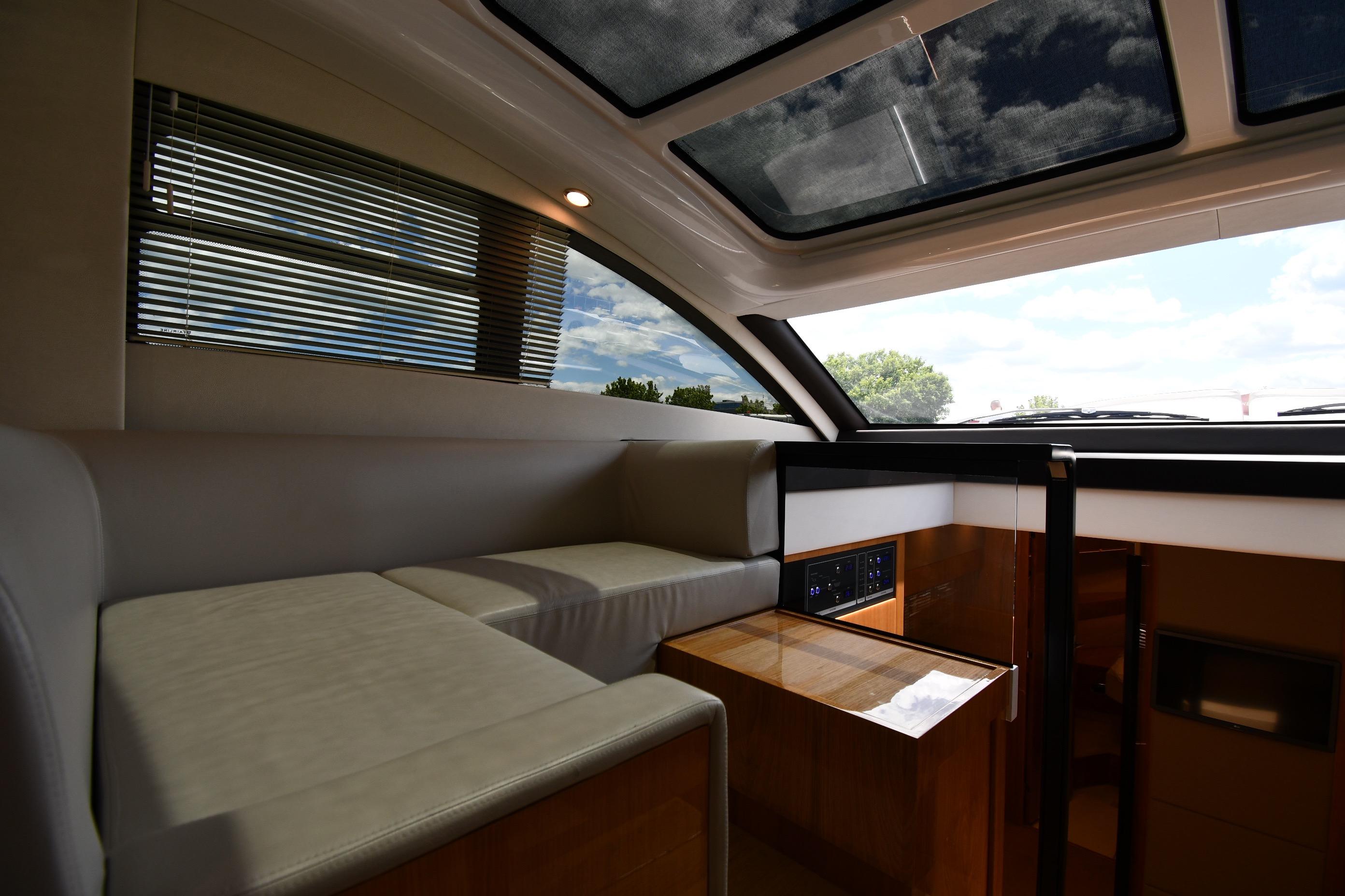 Luxurious interior of 2024 Fairline G50 Targa yacht with panoramic windows and sleek design.