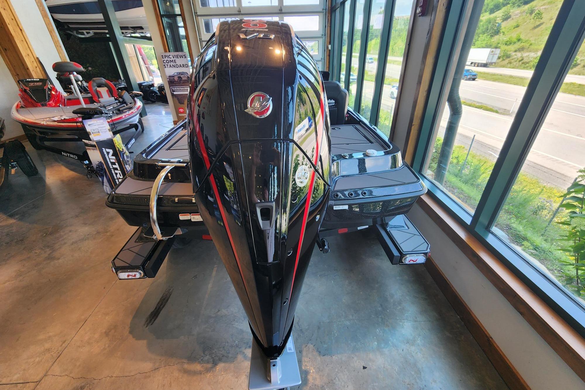2026 Nitro Z19 XL Pro boat displayed indoors with scenic window view.