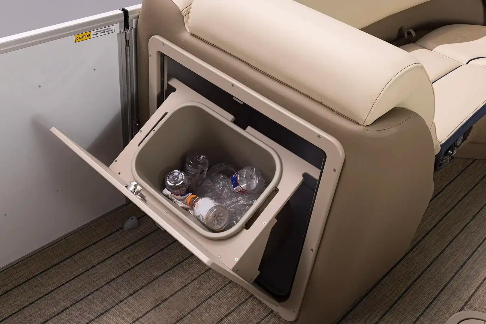 Manufacturer Provided Image: Built-in storage compartment on 2026 SunCatcher Select 322RC boat with bottles inside.