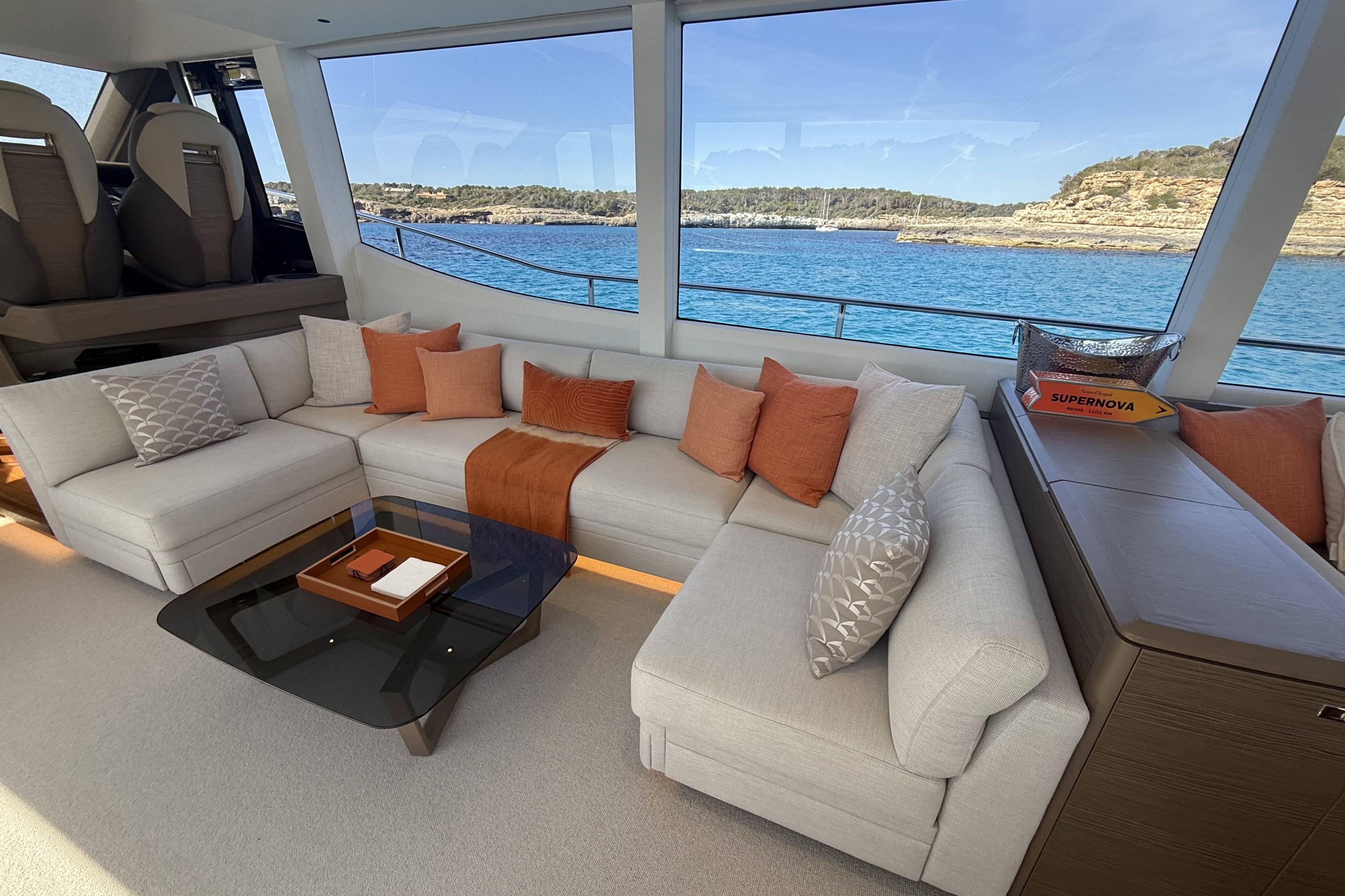 Luxurious interior of 2025 Princess Y72 yacht with elegant seating and ocean view.
