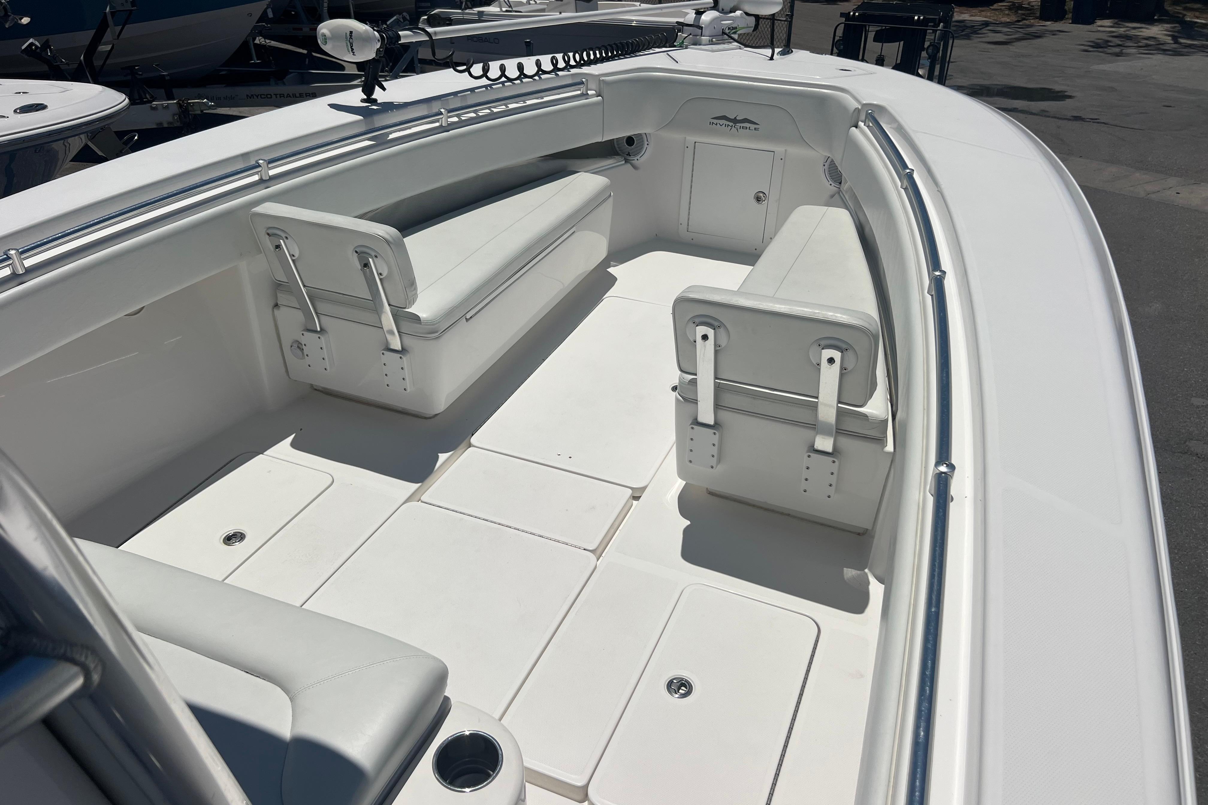 2012 Invincible 33 Open Fisherman boat interior with white seating and spacious deck.