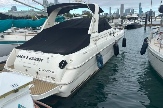 2000 Sea Ray Sundancer 310 docked in Chicago marina with city skyline.