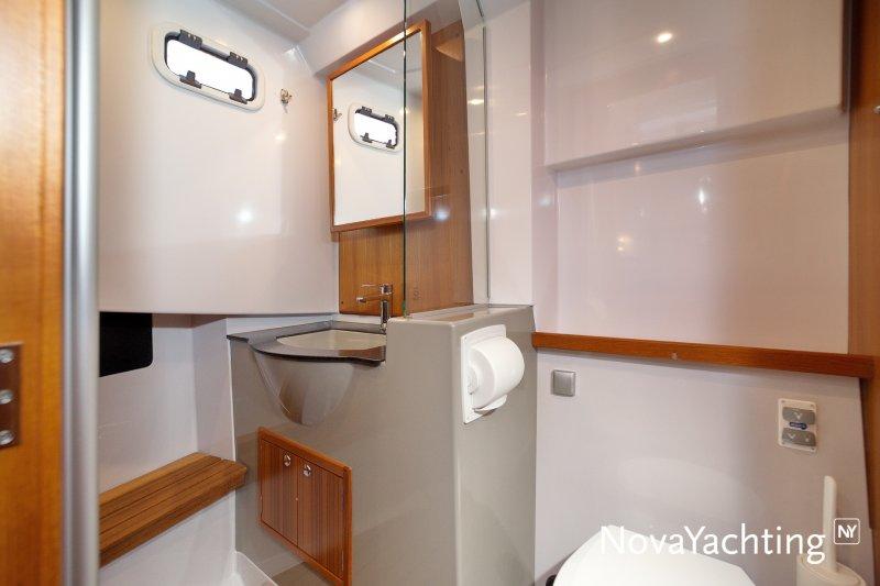 Modern bathroom interior of 2017 Sargo 36 yacht, featuring sleek design and wooden accents.