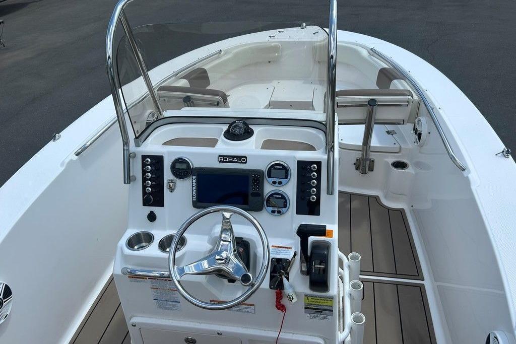 2017 Robalo R200ES boat cockpit with steering wheel, controls, and seating.