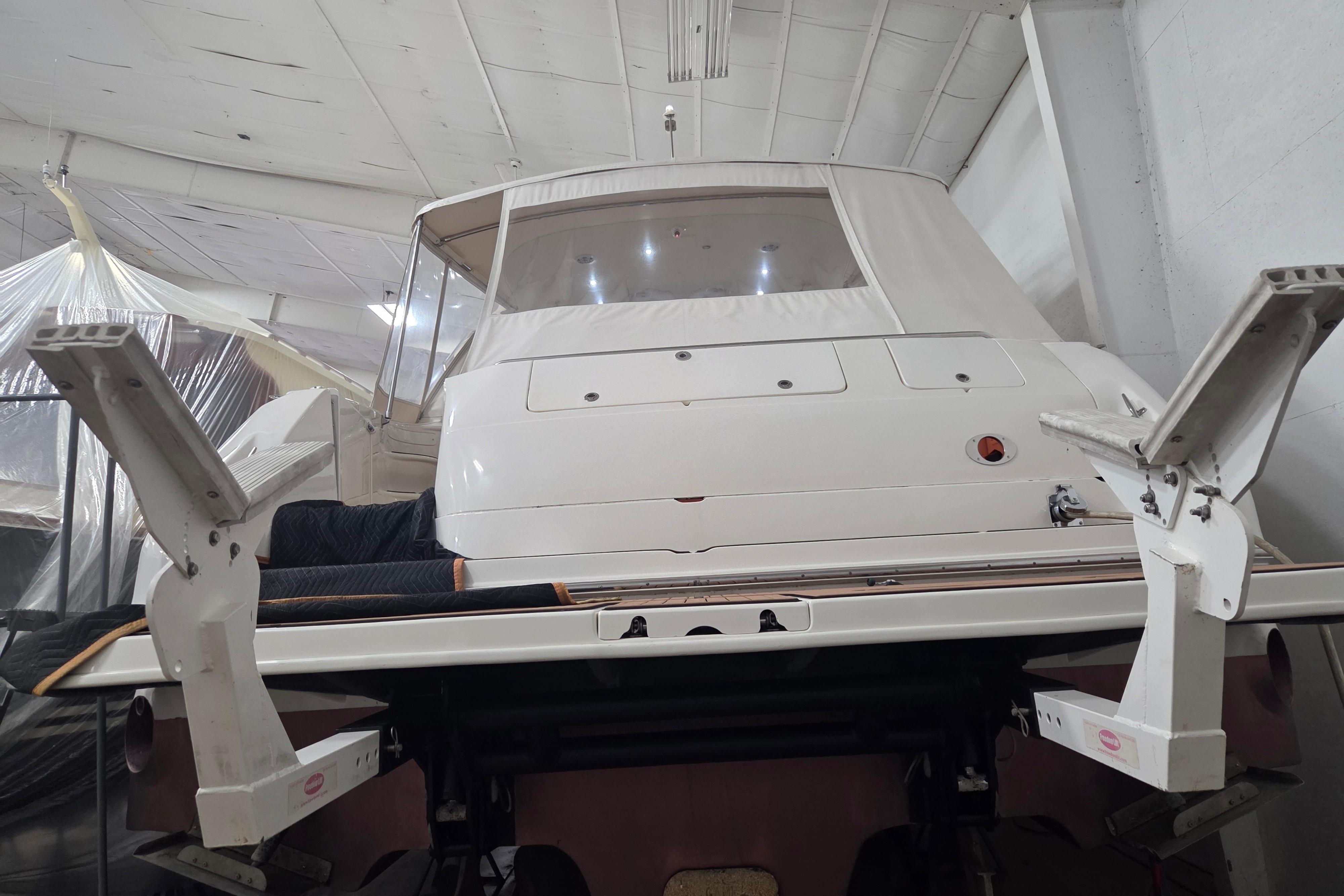 2000 Sea Ray Sundancer 540 yacht in indoor storage, rear view.