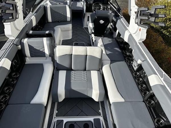2025 Malibu Wakesetter 26 LSV interior with gray and white seating, spacious layout.