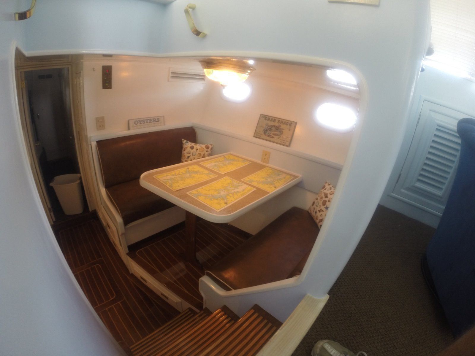 Interior of a 1963 Burger Flush Deck yacht with dining area.