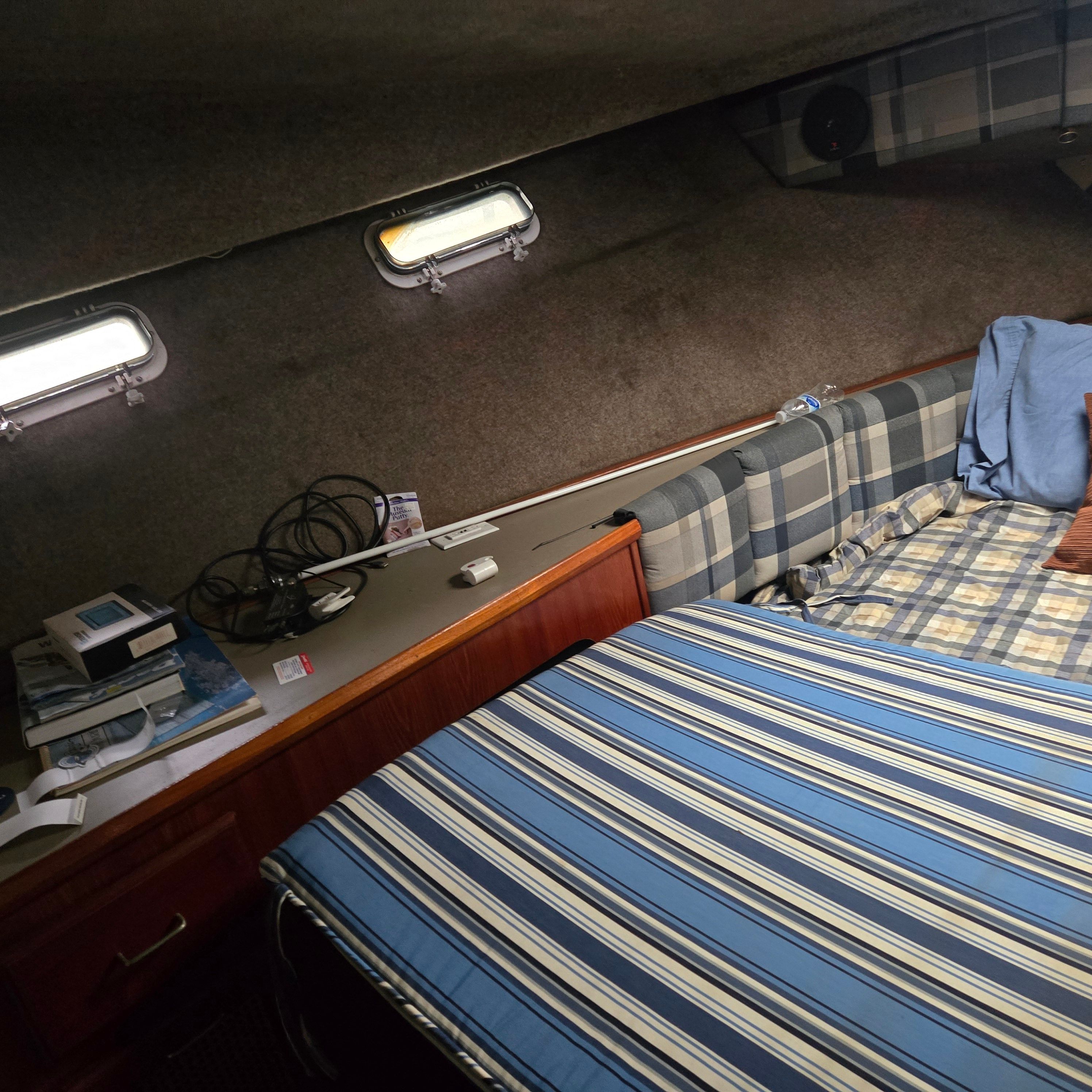 Interior of 1984 Bayliner 3870 Motoryacht with cozy sleeping area.