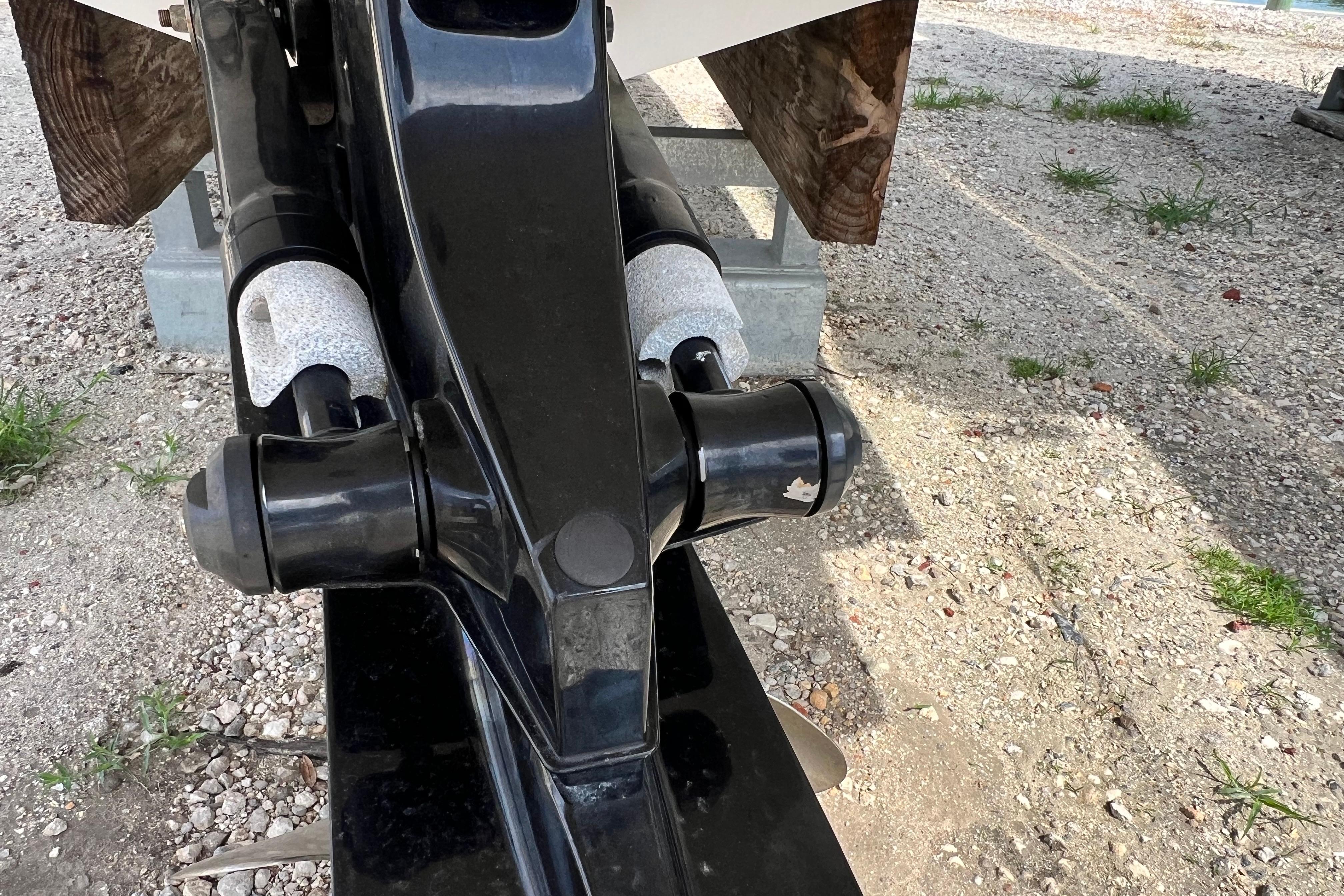 Close-up of a 2015 Monterey 268SS Super Sport boat trailer detail on gravel.