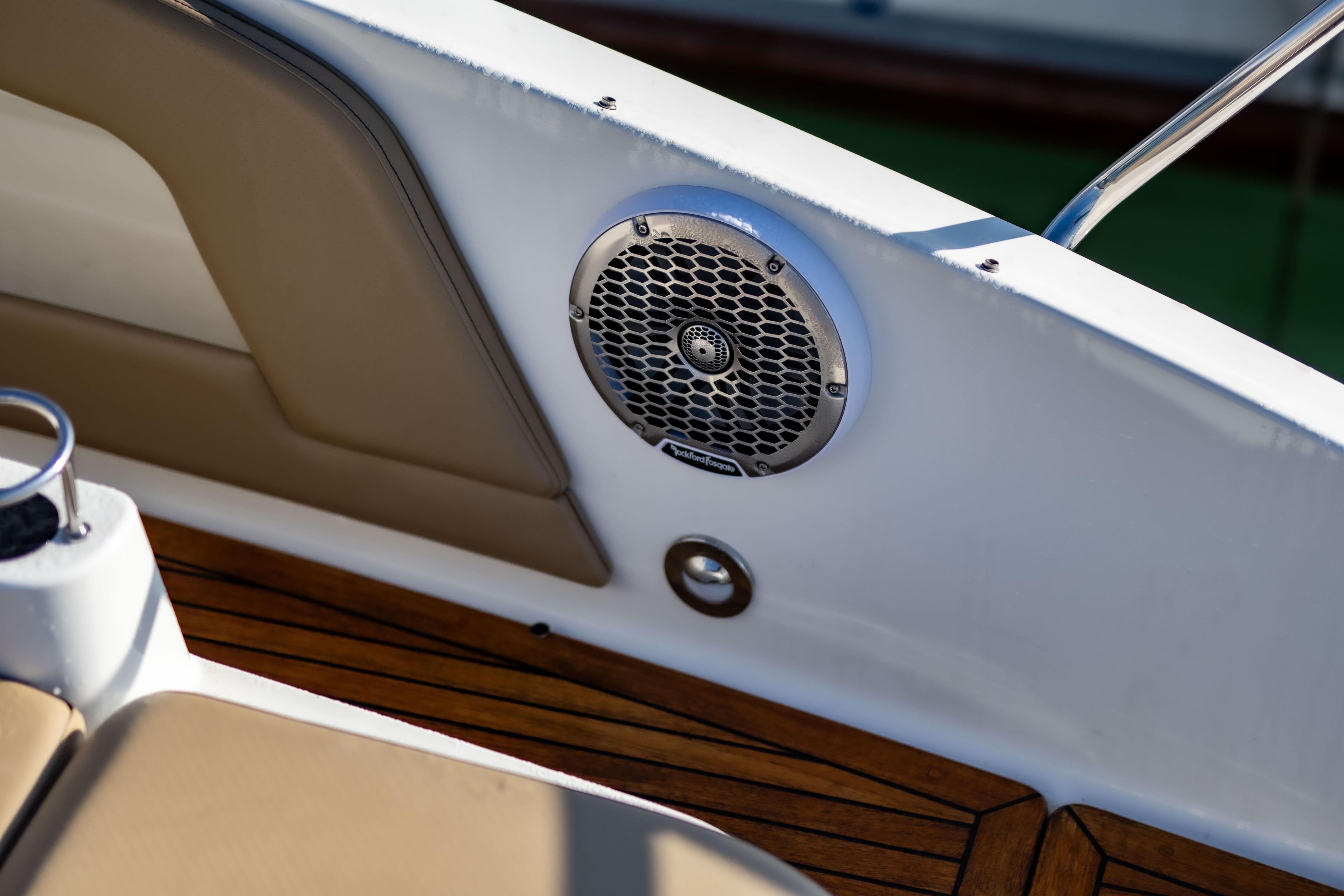 2022 Sea Ray Sundancer 320 boat interior with speaker and wooden deck.