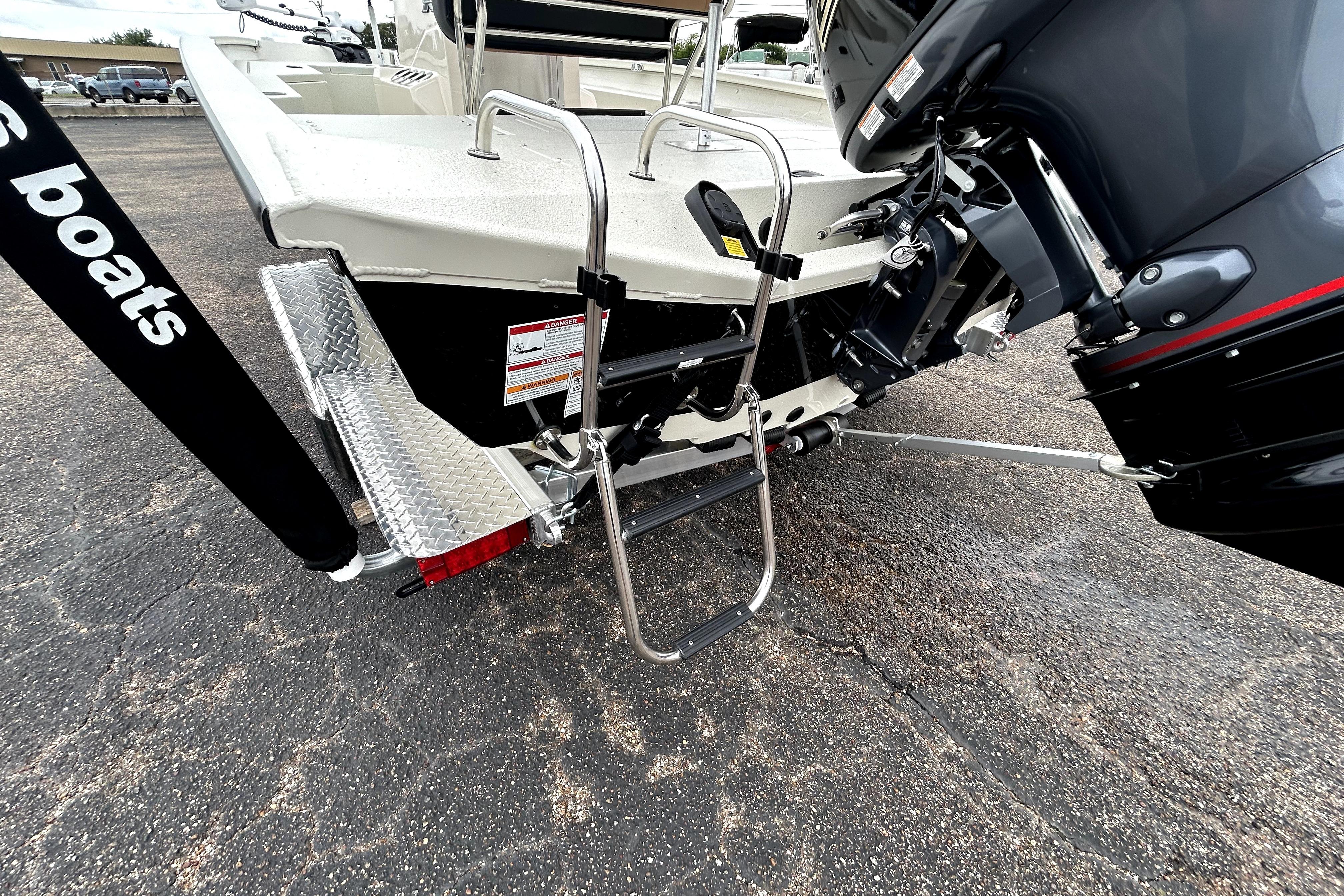 Rear view of 2026 Xpress H20B Bay boat with motor and ladder.