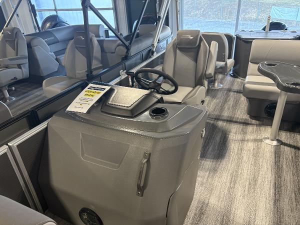 2025 Bennington 21 SF boat interior with steering console and seating.