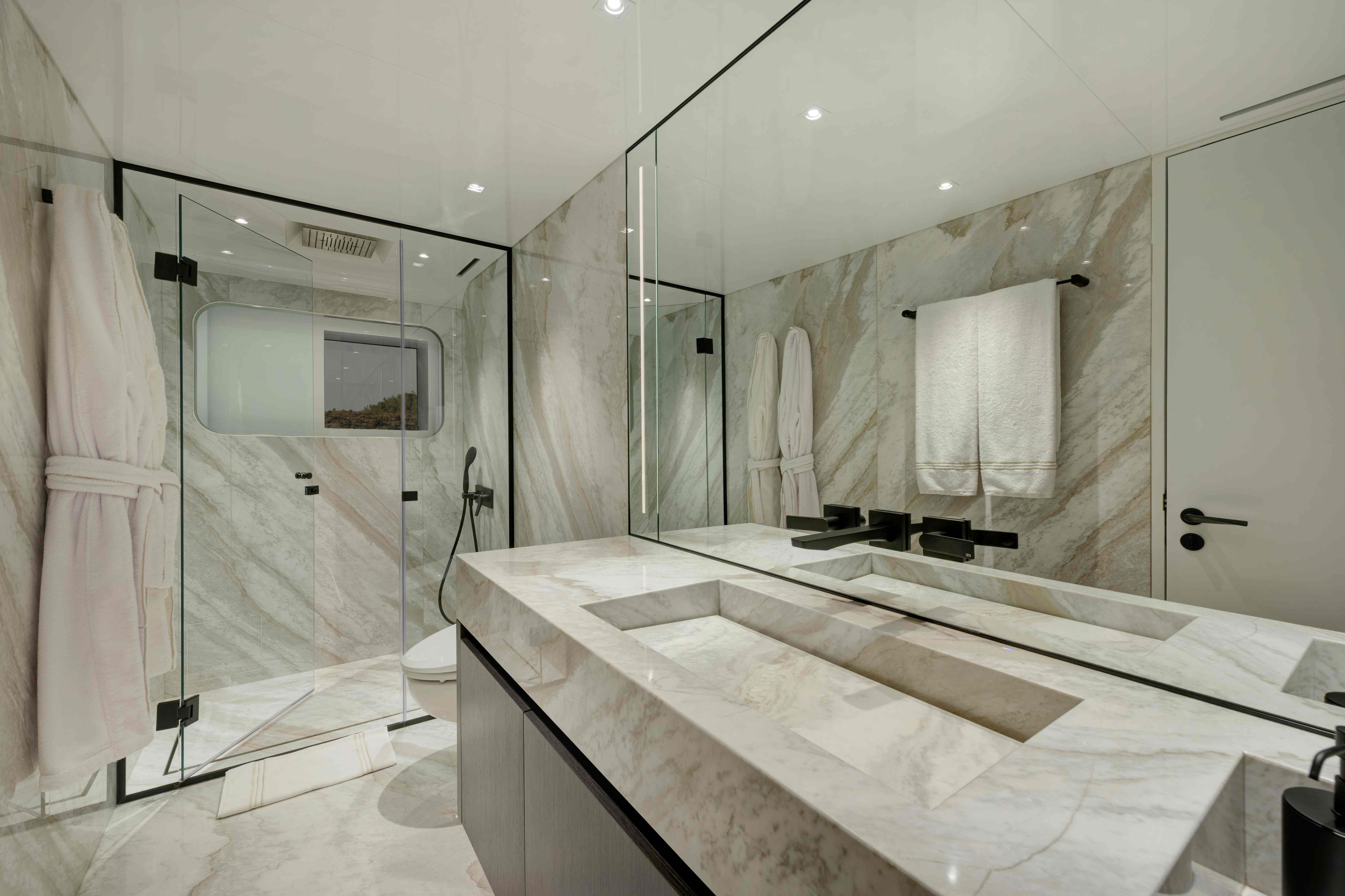 Luxurious marble bathroom in 2025 Ada Yacht 50 Z, featuring modern fixtures and spacious design.