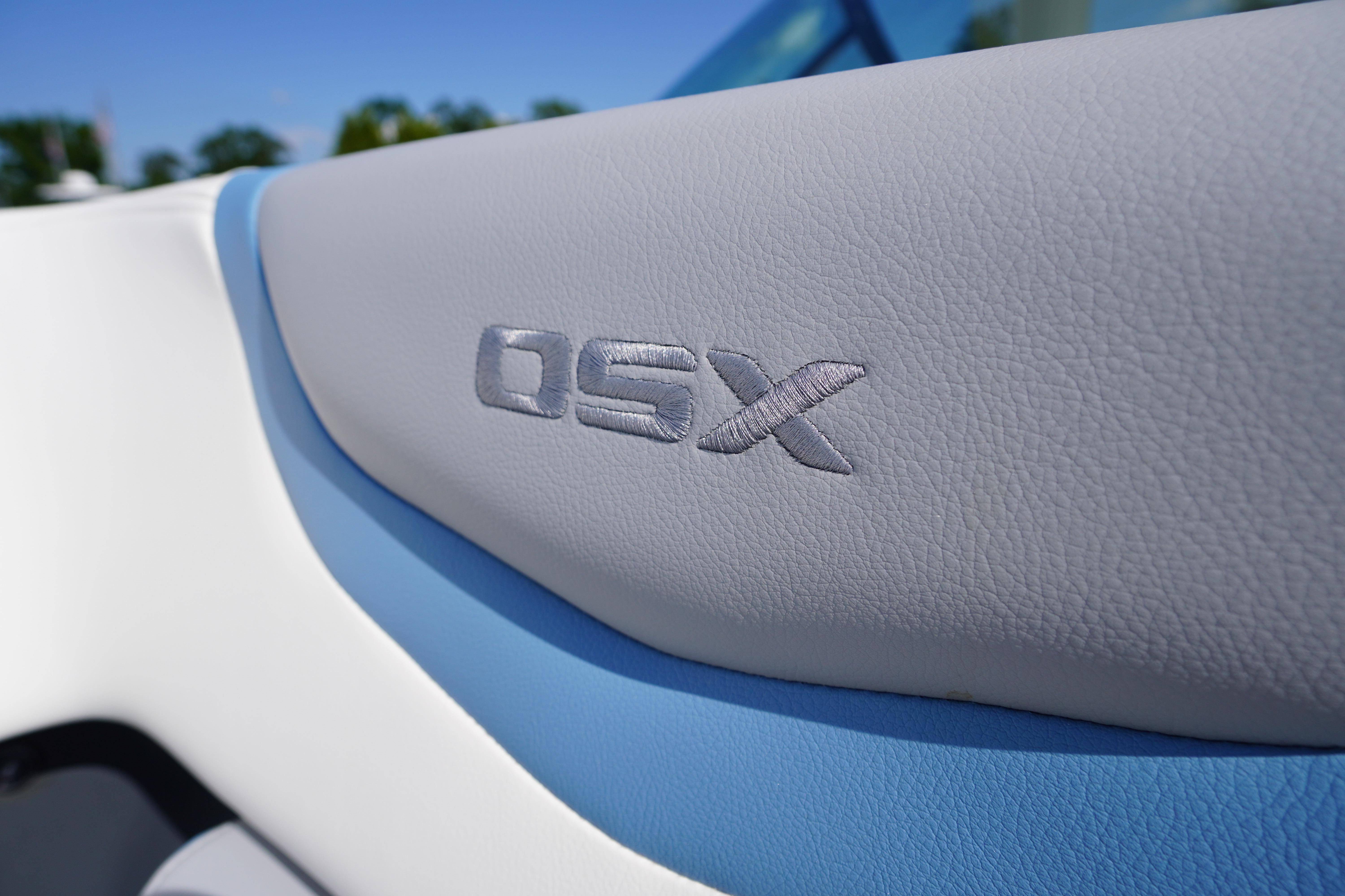 Close-up of 2026 Chaparral 270 OSX boat interior with embossed "OSX" logo.