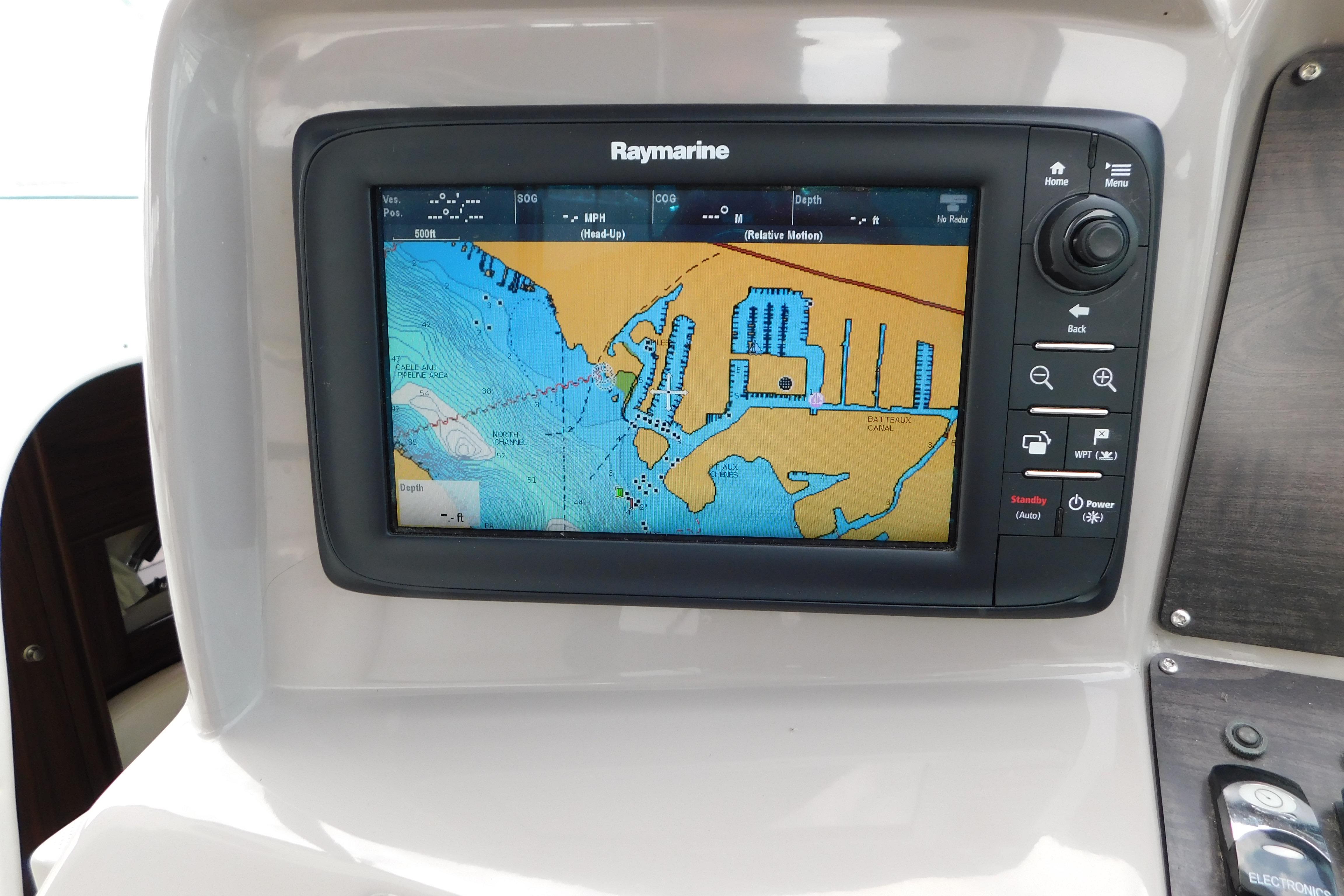 Raymarine navigation display on 2017 Rinker EX 320 boat, showing detailed marine chart.