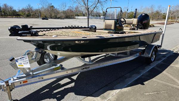 2025 Mako 18 Pro Skiff Backwater Edition on trailer in parking lot.