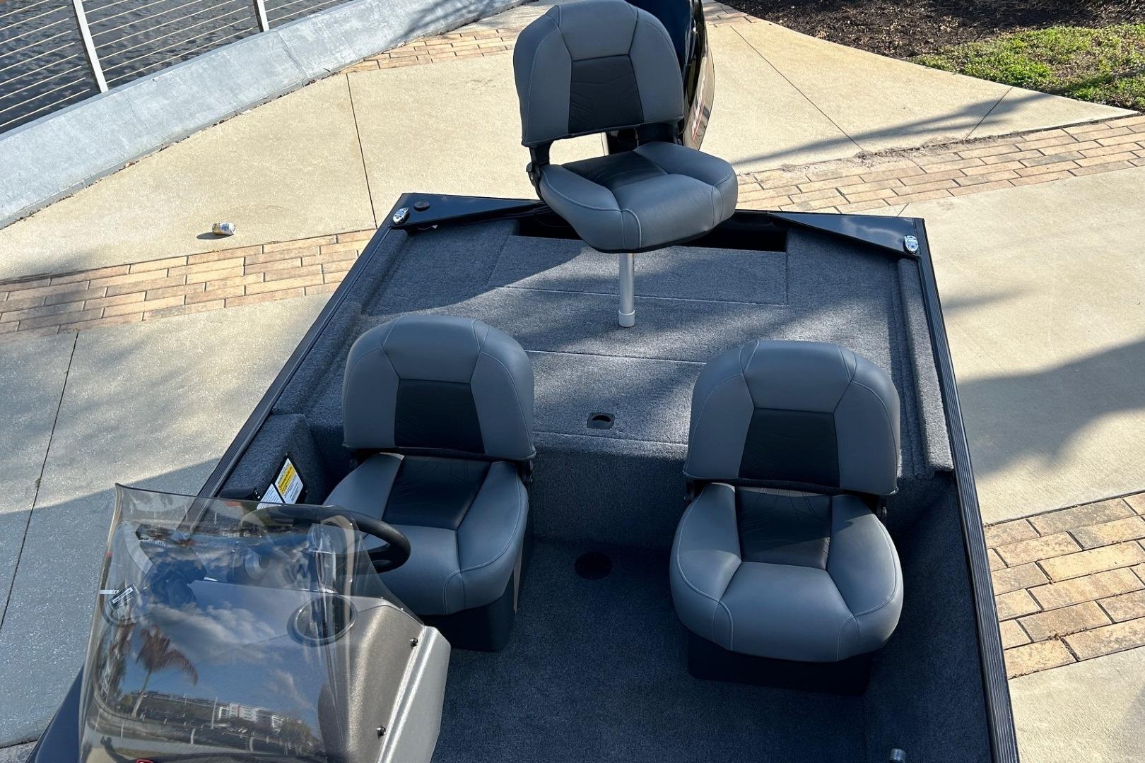 2026 Tracker Bass Tracker Classic XL boat interior with three gray seats.