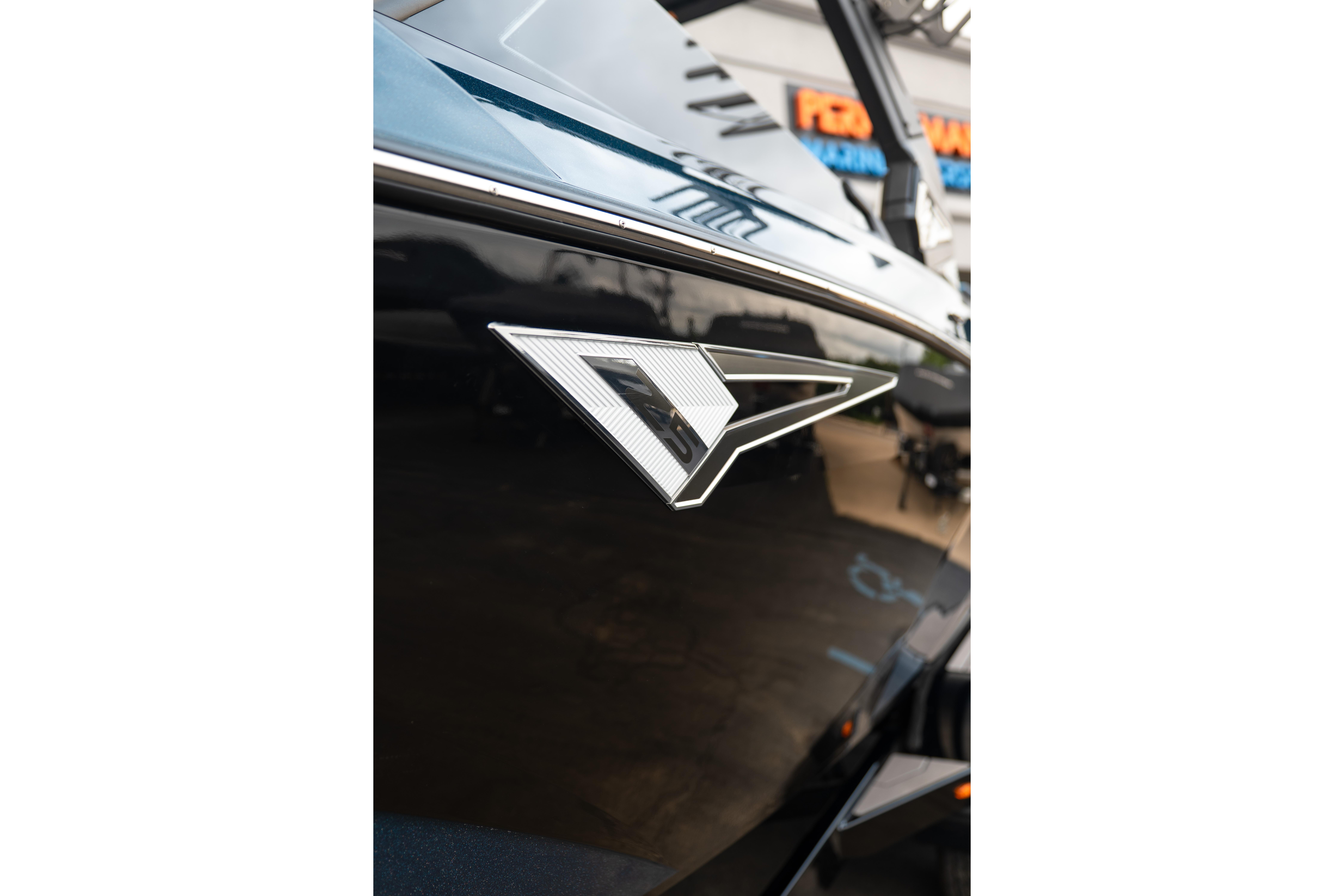 2024 Tigé Z5 boat emblem on sleek black exterior.