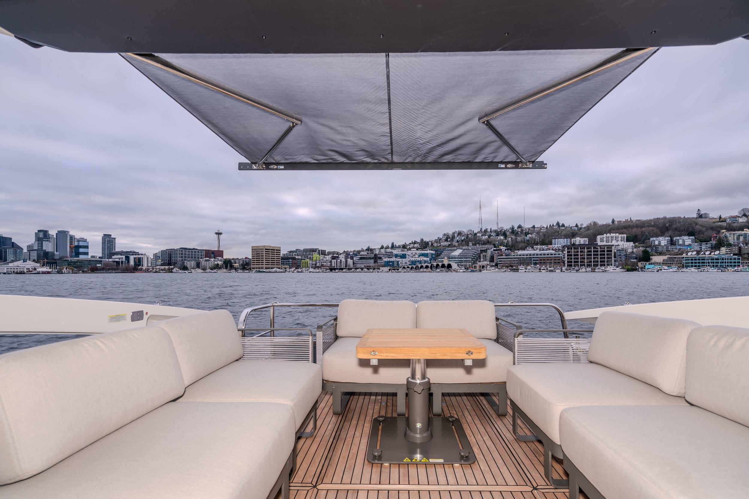 Luxurious Absolute 48 Coupe yacht interior with city skyline view, 2026 model.