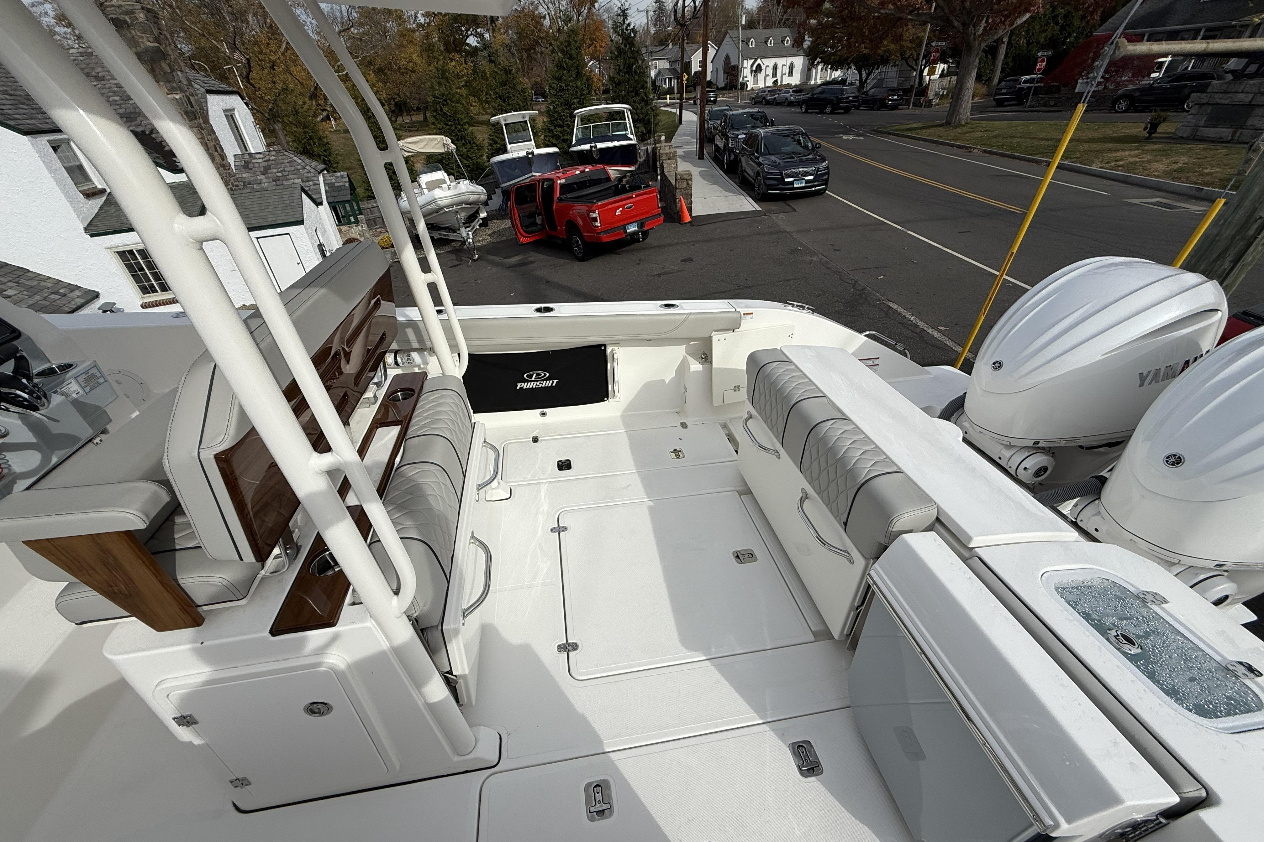 2026 Pursuit S 288 Sport boat interior with seating and dual Yamaha engines.