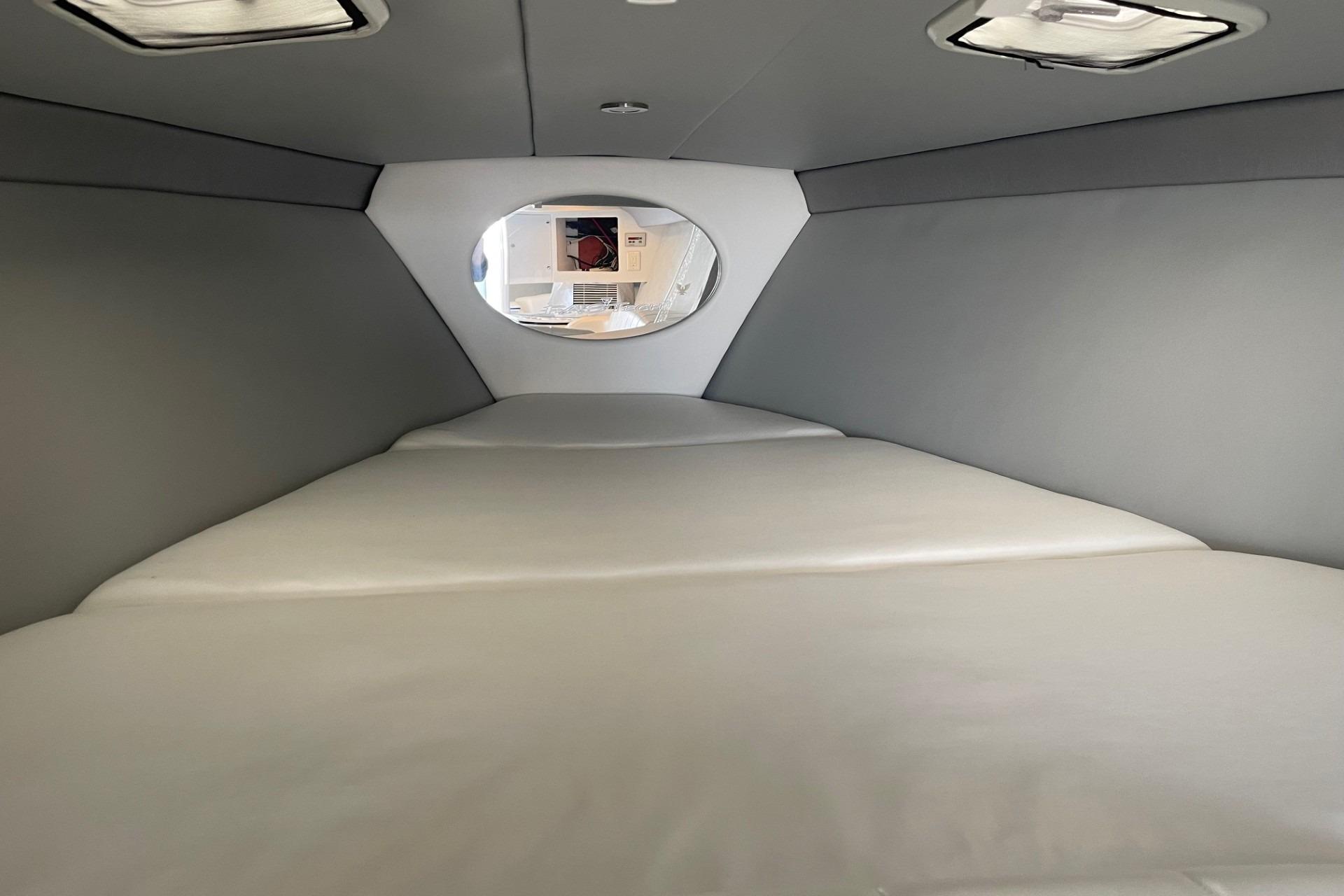 Interior cabin of a 2004 Formula 382 FASTech boat, featuring a spacious sleeping area.