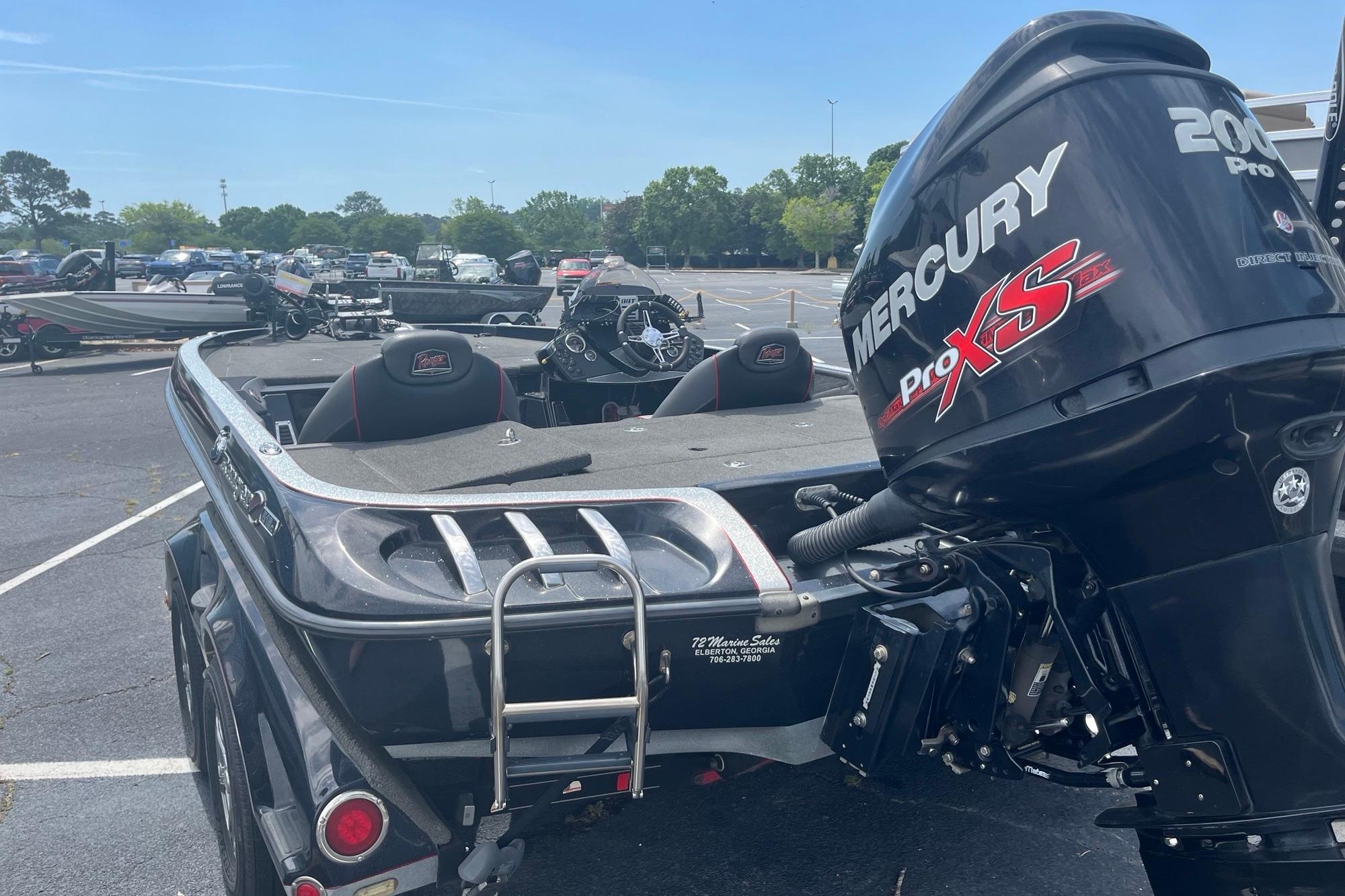 2017 Ranger Z518 Cup-Equipped boat with Mercury Pro XS engine in parking lot.