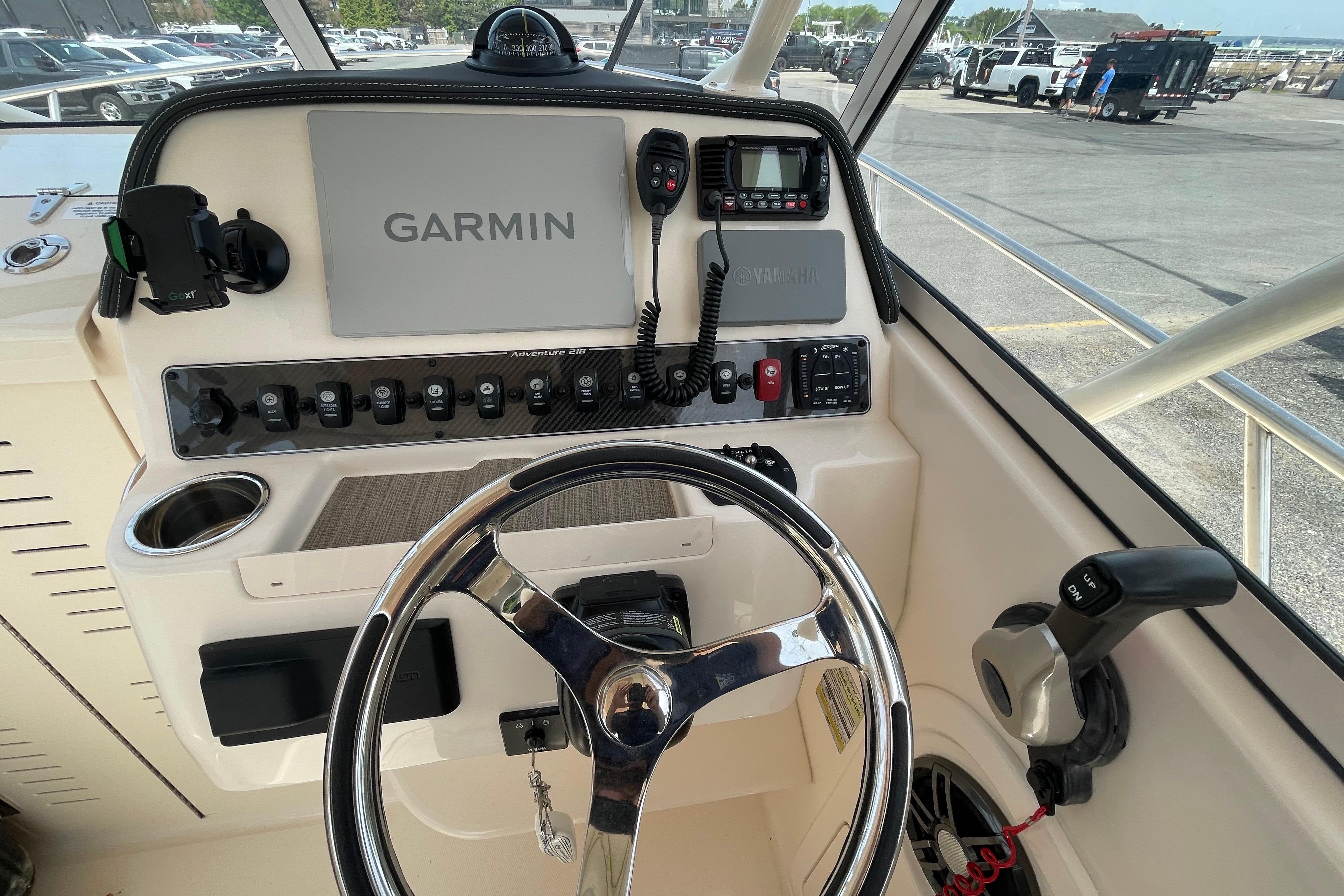 2024 Grady-White Adventure 218 boat dashboard with Garmin navigation system and controls.