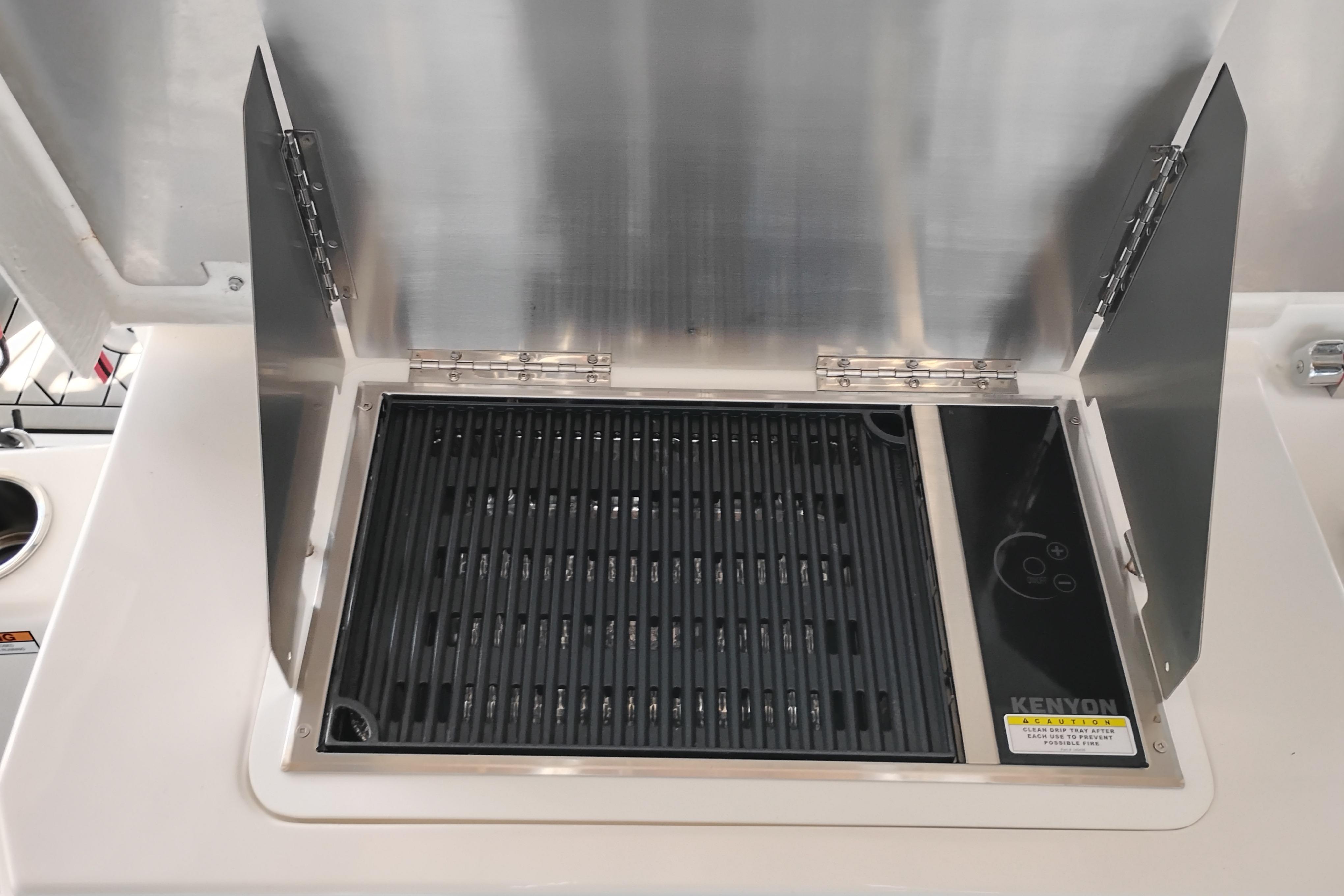 Built-in Kenyon grill on 2022 Cutwater C-32 Coupe boat.