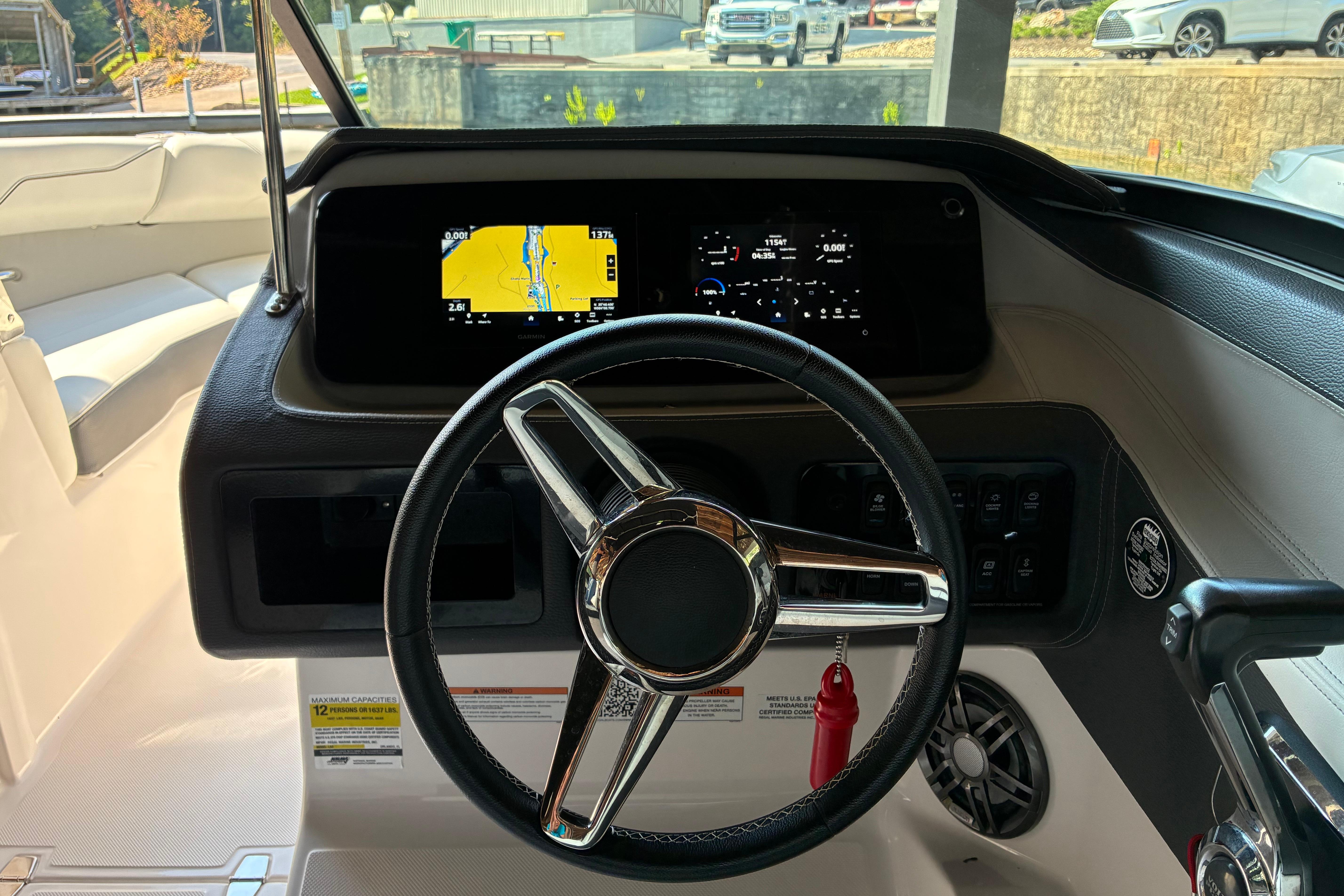 2025 Regal LS2 boat dashboard with steering wheel and digital display.