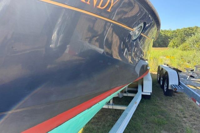 Latitude 46 Andreyale 10m boat from 2000 on trailer, side view.