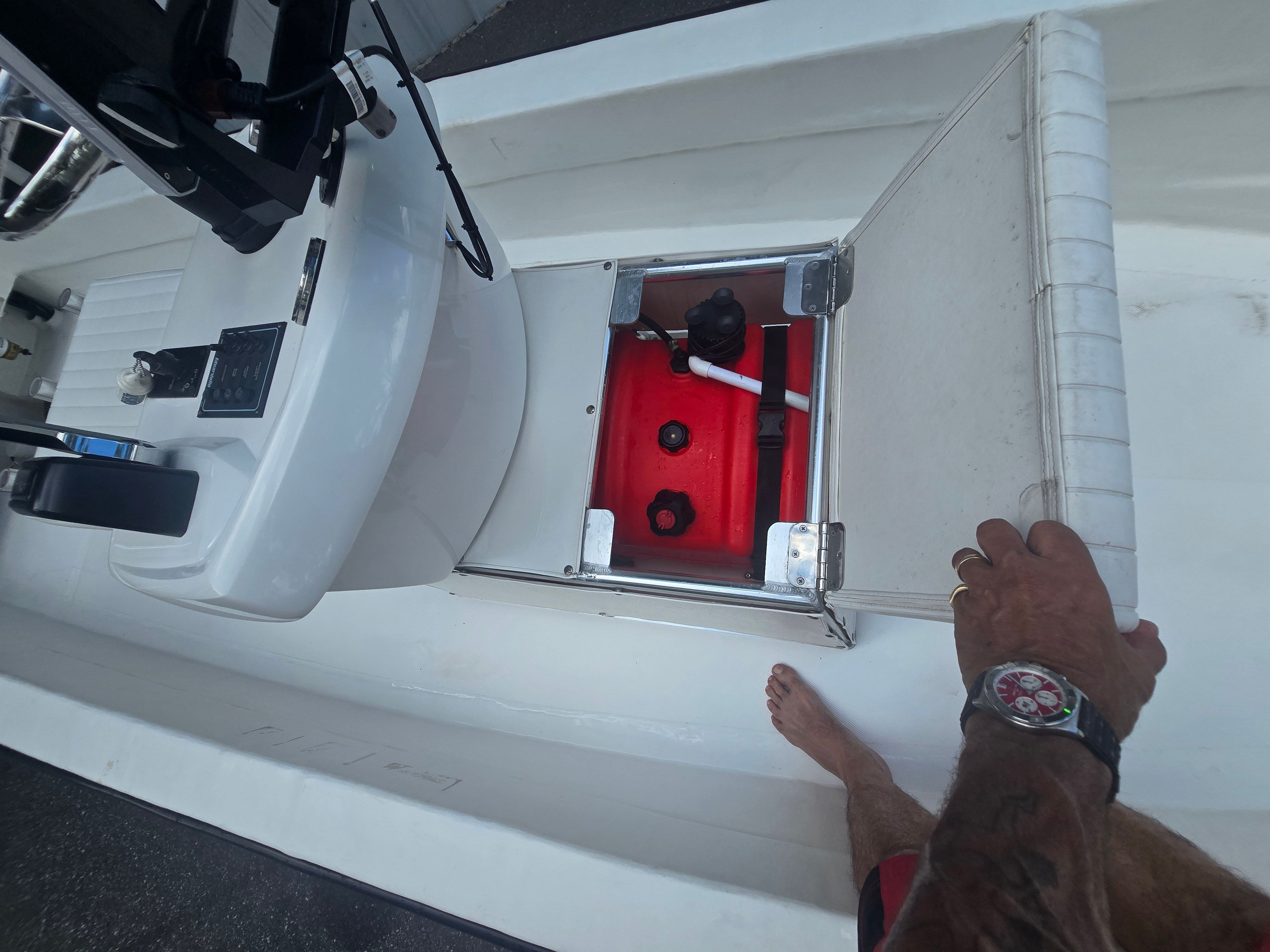 Interior view of a 2022 Panga Eduardono boat with open storage compartment.
