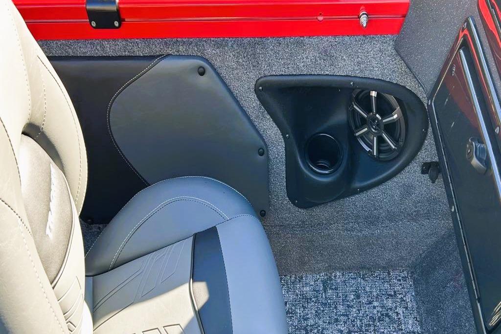 2026 Tracker Targa V-19 Combo interior with speaker and gray seating.