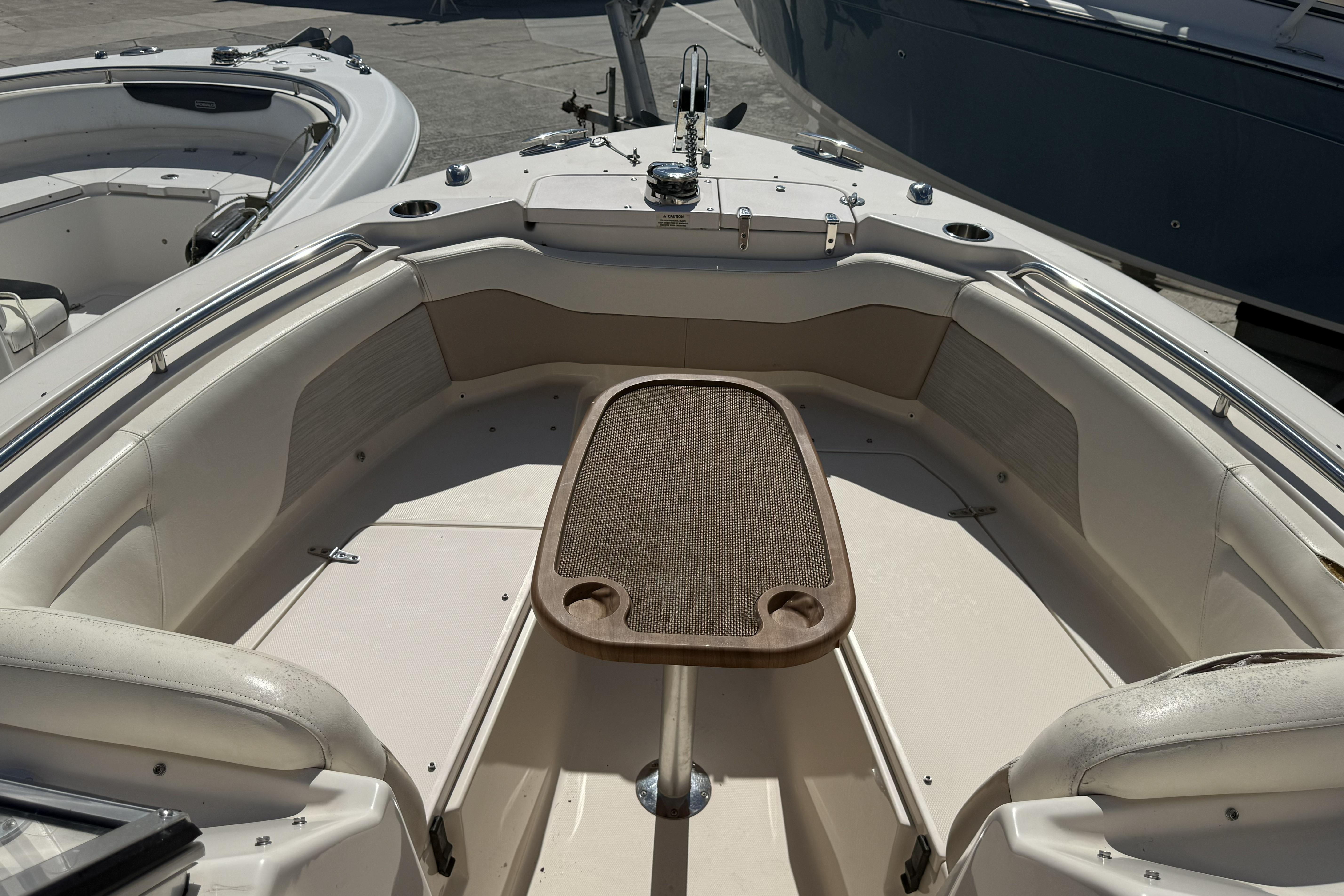 2014 Grady-White Freedom 275 boat interior with seating and table.