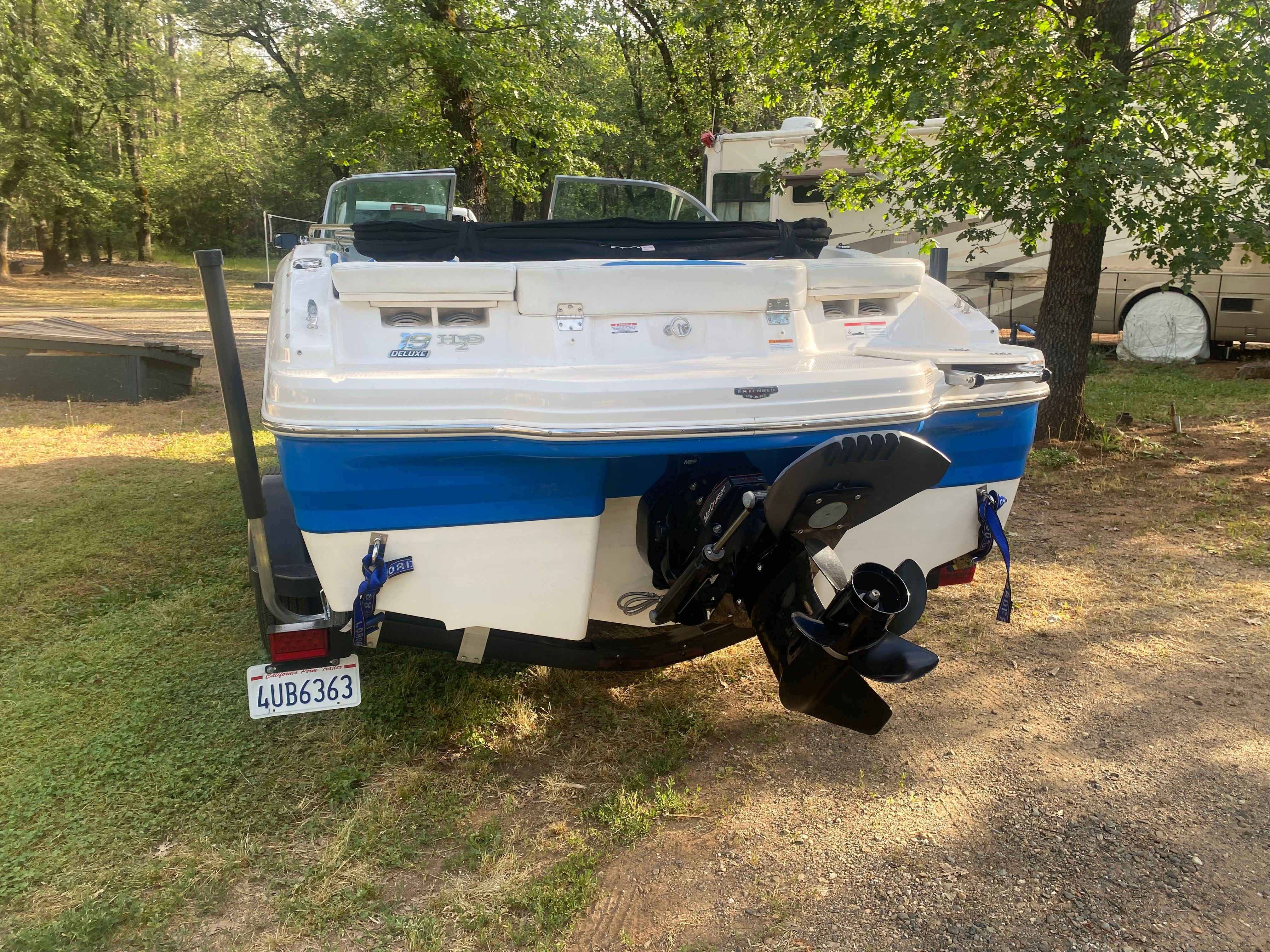 The image shows a 2017 Chaparral 19 H2O Sport boat on a trailer outdoors.