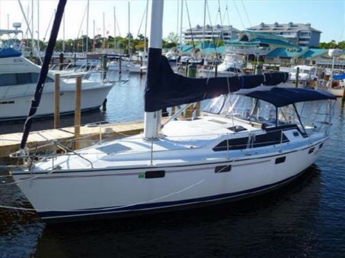 1995 Hunter 36 Vision sailboat docked at marina.