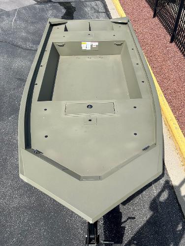 2025 Tracker Grizzly 1754 AWL boat, top view, parked on pavement.