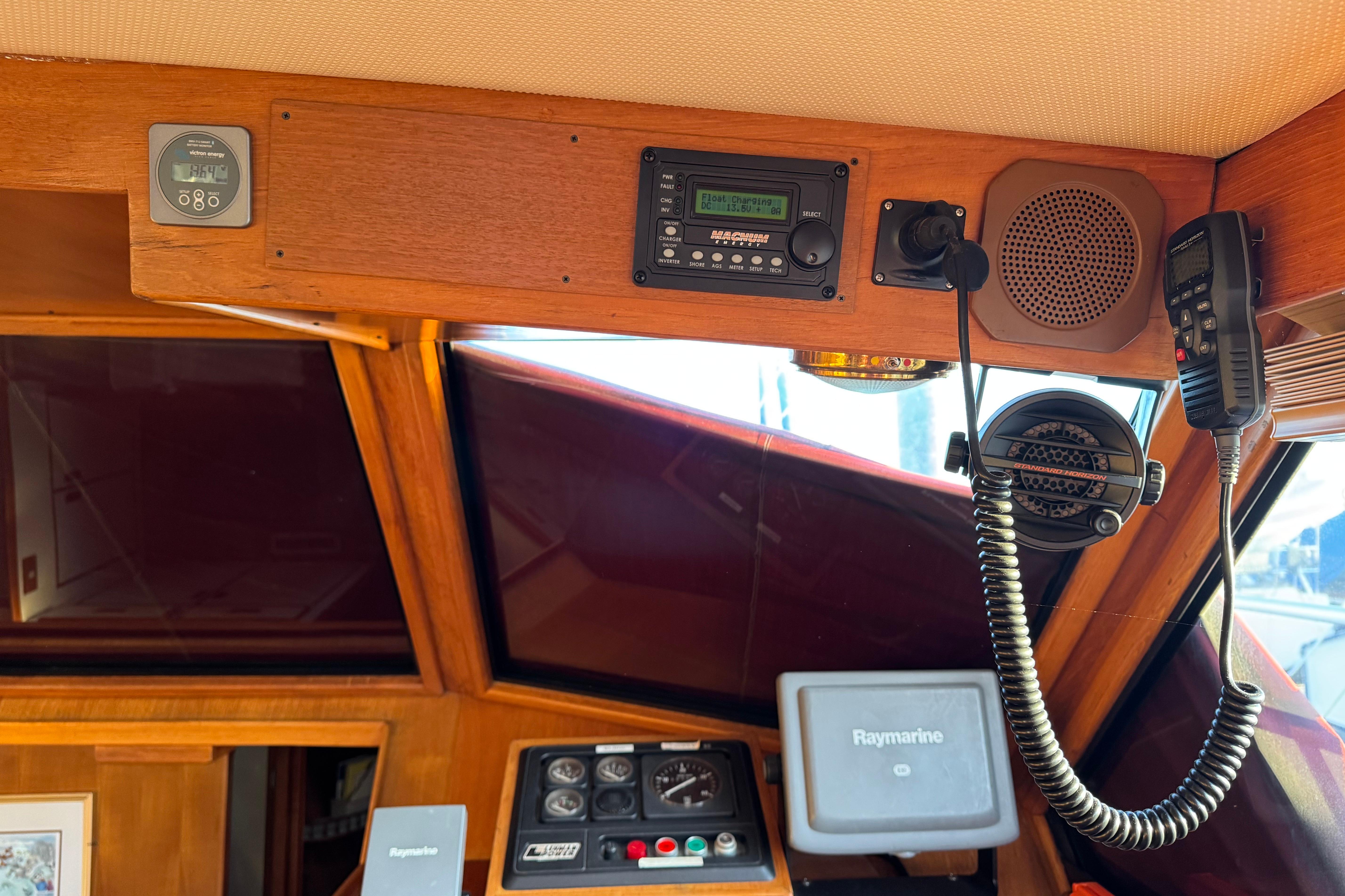 Interior of a 1987 President 37 boat cockpit with navigation equipment and communication devices.